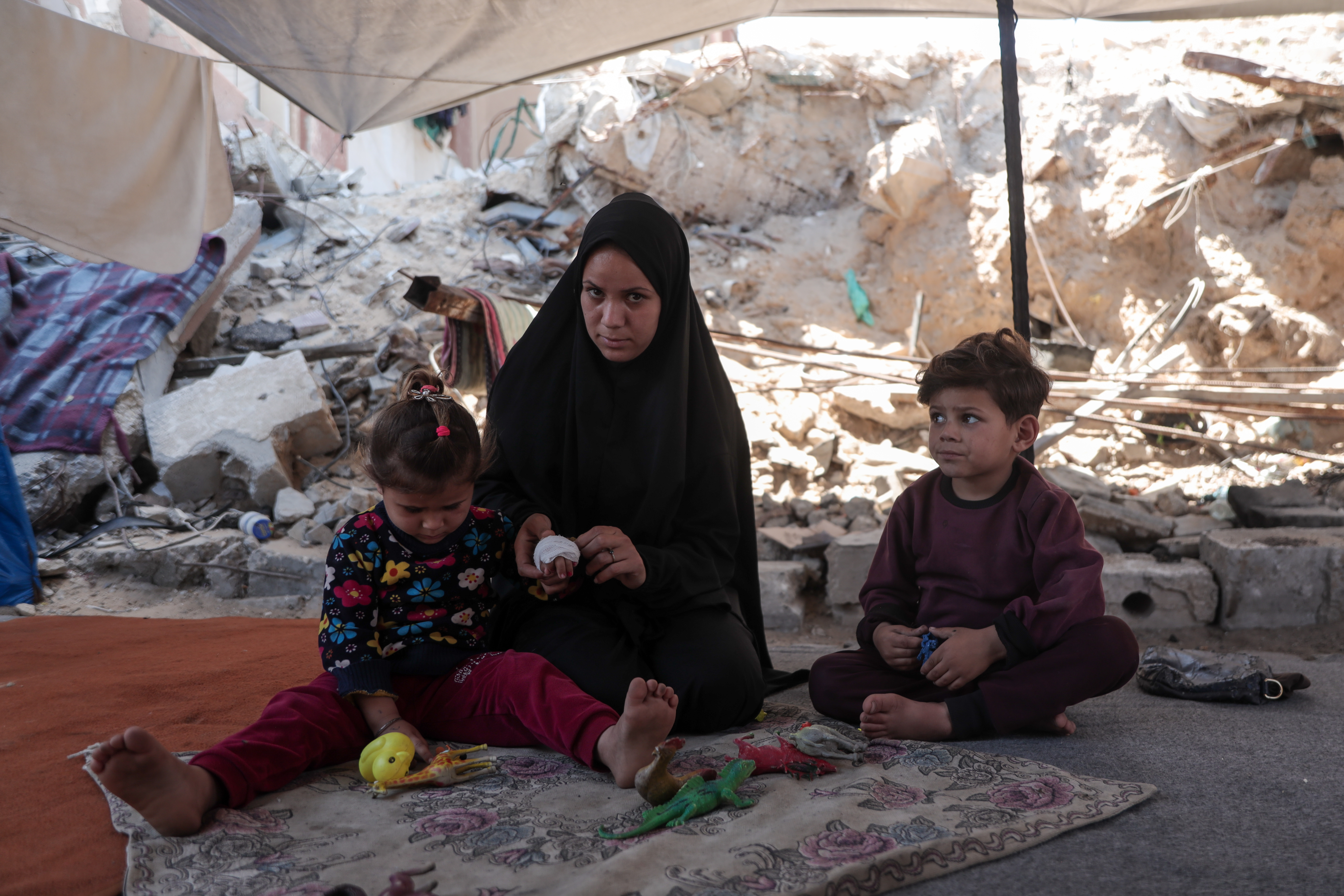 Family in Gaza under a canopy