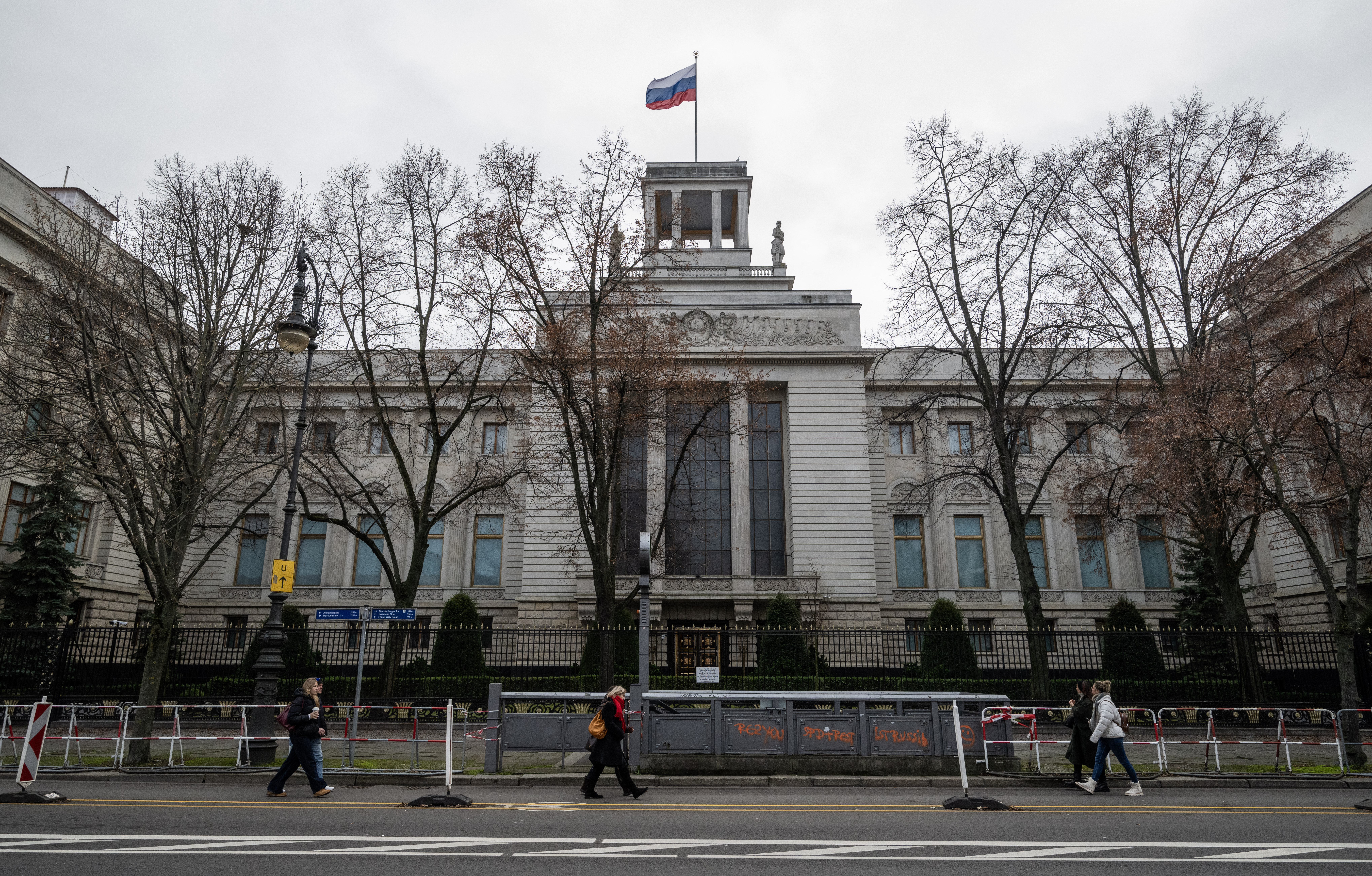 People walking past the Russian embassy in Berlin
