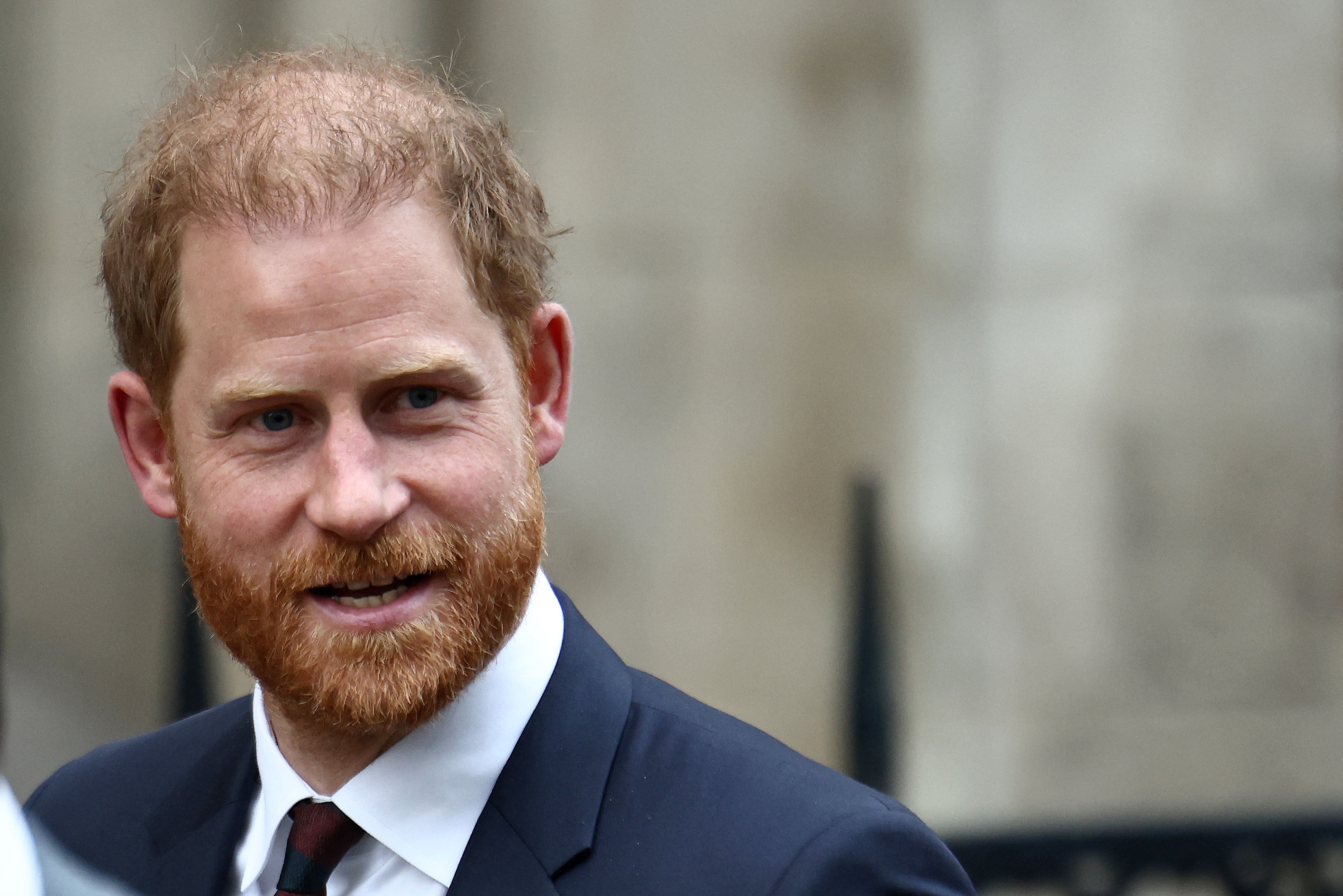 Britain's Prince Harry, Duke of Sussex, reacts as he leaves the Royal Courts of Justice, Britain's High Court, in London on January 22, 2026.