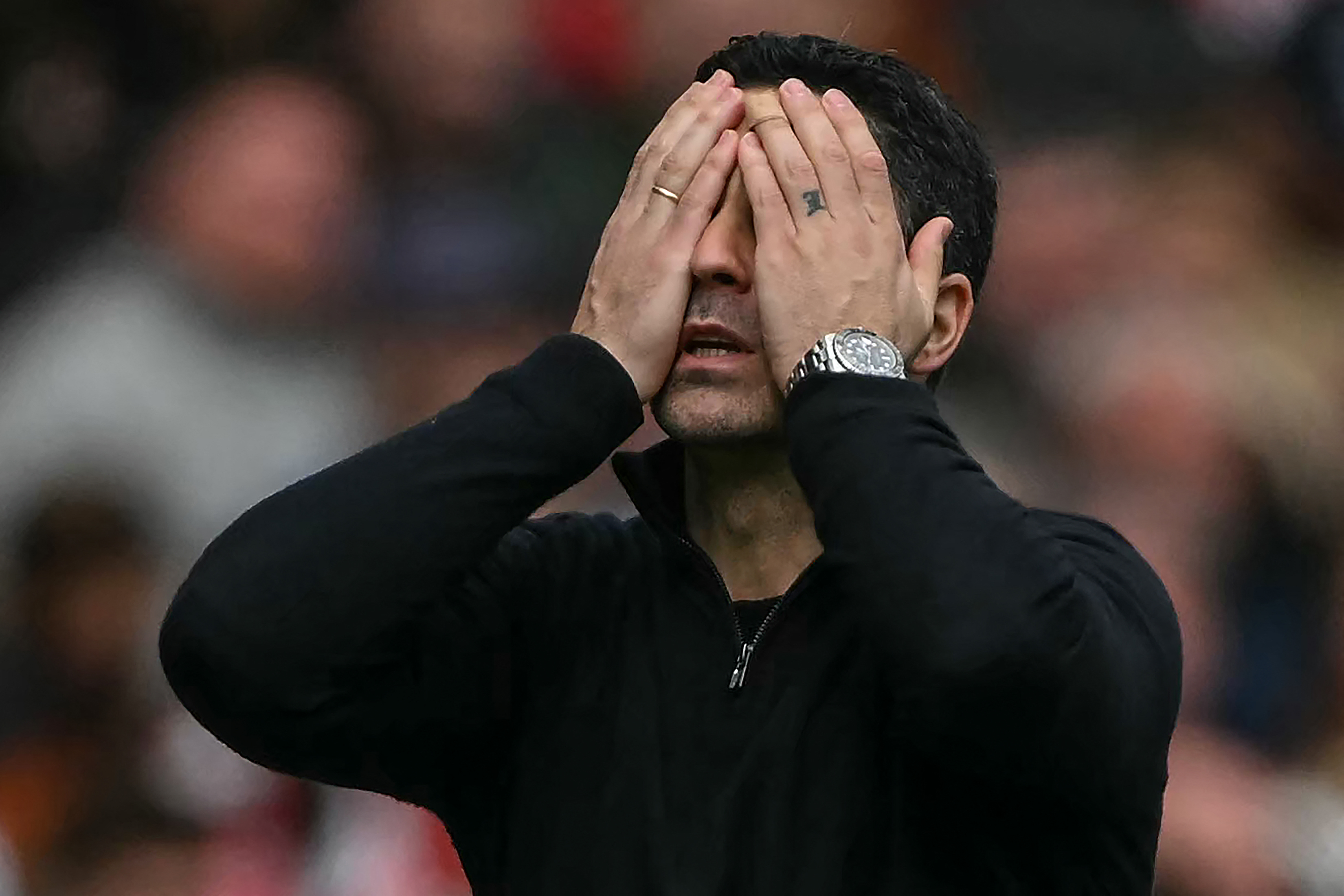 Arsenal's Spanish manager Mikel Arteta reacts during the English Premier League football match between Arsenal and Bournemouth at the Emirates Stadium in London on April 11, 2026. (Photo by Glyn KIRK / AFP) / RESTRICTED TO EDITORIAL USE. No use with unauthorized audio, video, data, fixture lists, club/league logos or 'live' services. Online in-match use limited to 120 images. An additional 40 images may be used in extra time. No video emulation. Social media in-match use limited to 120 images. An additional 40 images may be used in extra time. No use in betting publications, games or single club/league/player publications. /
