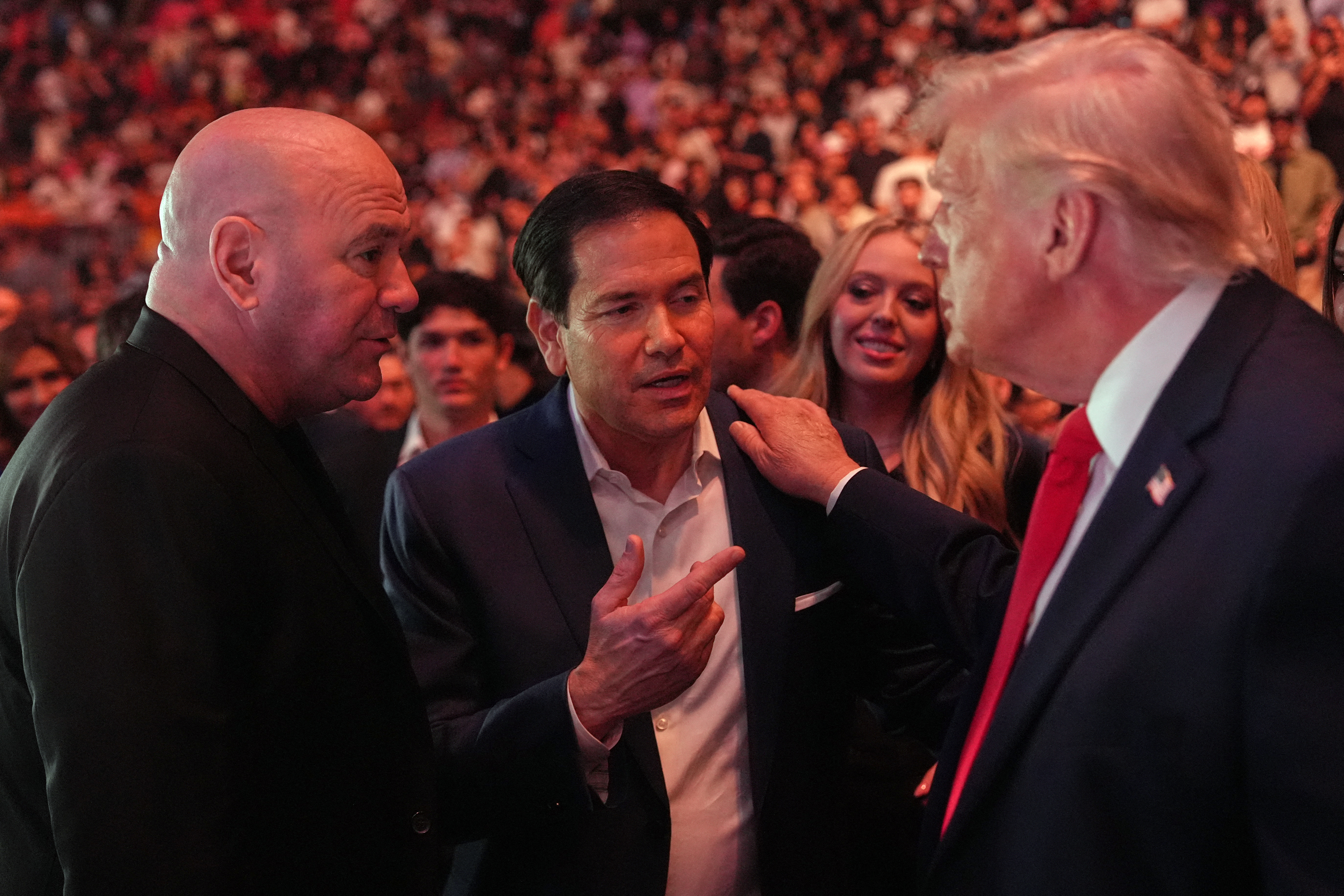 US President Donald Trump speaks with UFC CEO and president Dana White and US Secretary of State Marco Rubio during UFC 327: Jiri Prochazka vs Carlos Ulberg at Kaseya Center in Miami, on April 11, 2026. (Photo by Julia Demaree Nikhinson / POOL / AFP)