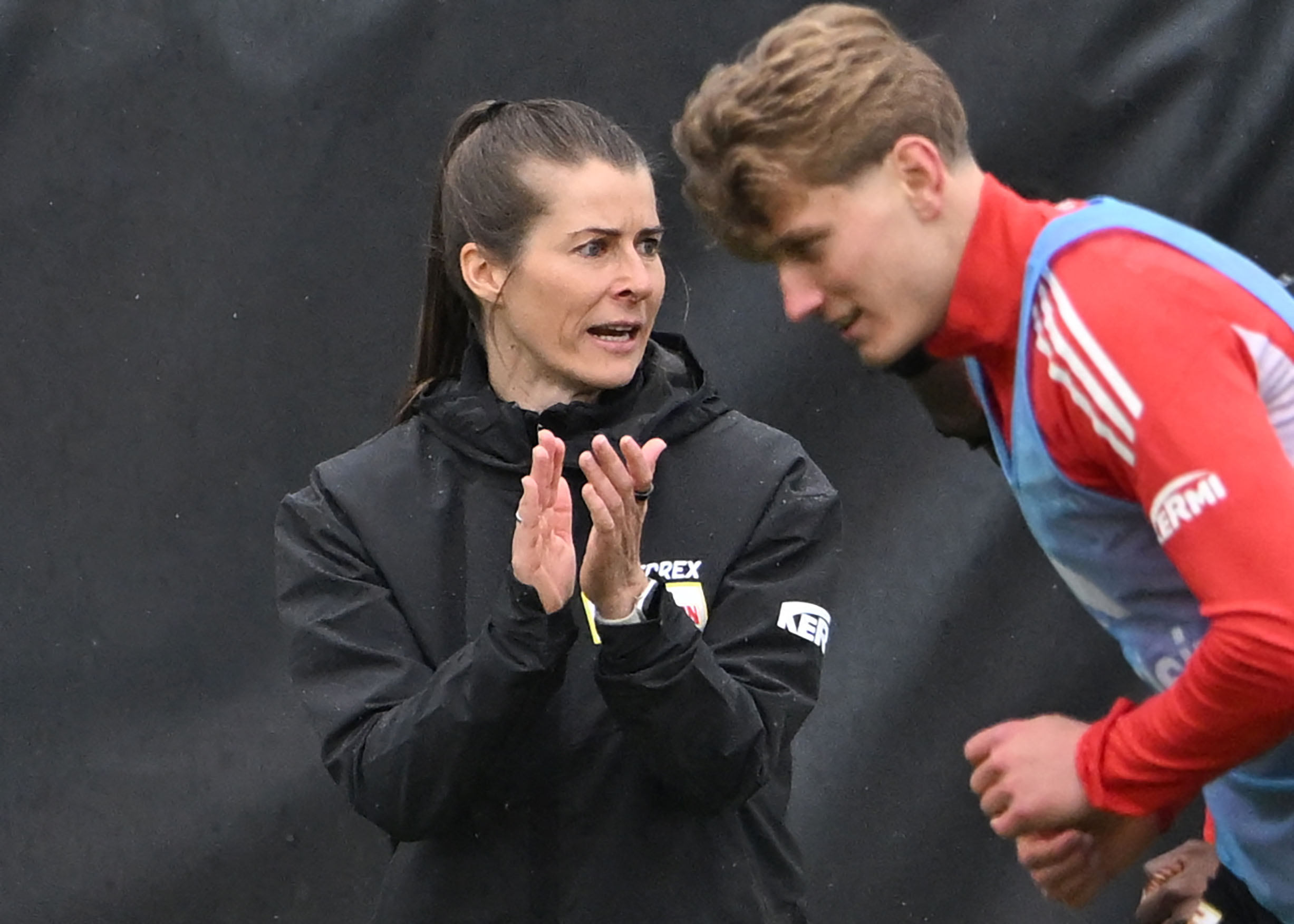 Union Berlin's new German head coach Marie-Louise Eta (L) reacts in a training session.