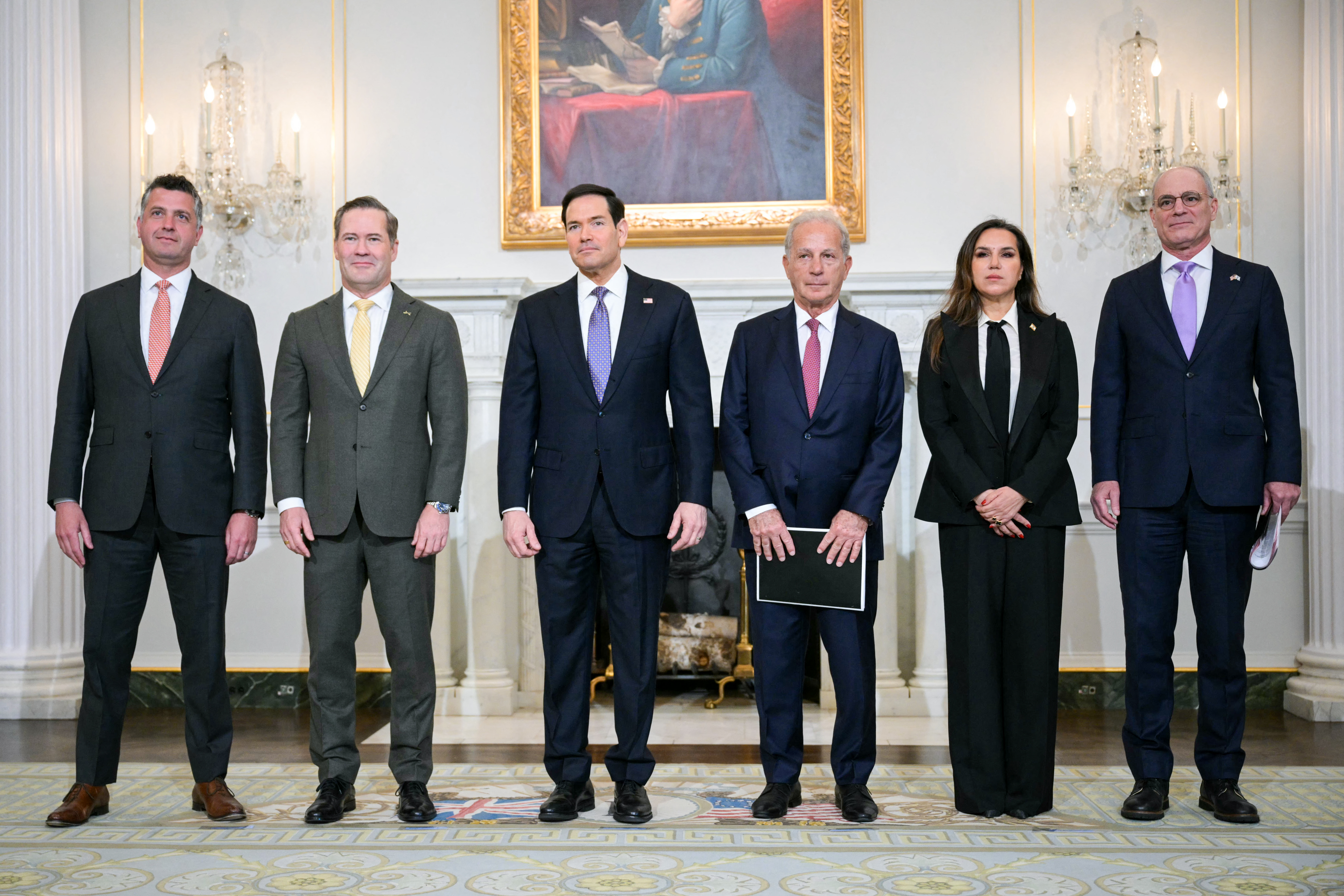 (L/R) US State Department Counselor Michael Needham, US Ambassador to the UN Mike Waltz, US Secretary of State Marco Rubio, US Ambassador to Lebanon Michel Issa, Lebanon's Ambassador to the US Nada Hamadeh Moawad, and Israeli Ambassador to the US Yechiel Leiter stand together before meeting at the State Department in Washington, DC, on April 14, 2026. (Photo by Oliver Contreras / AFP)