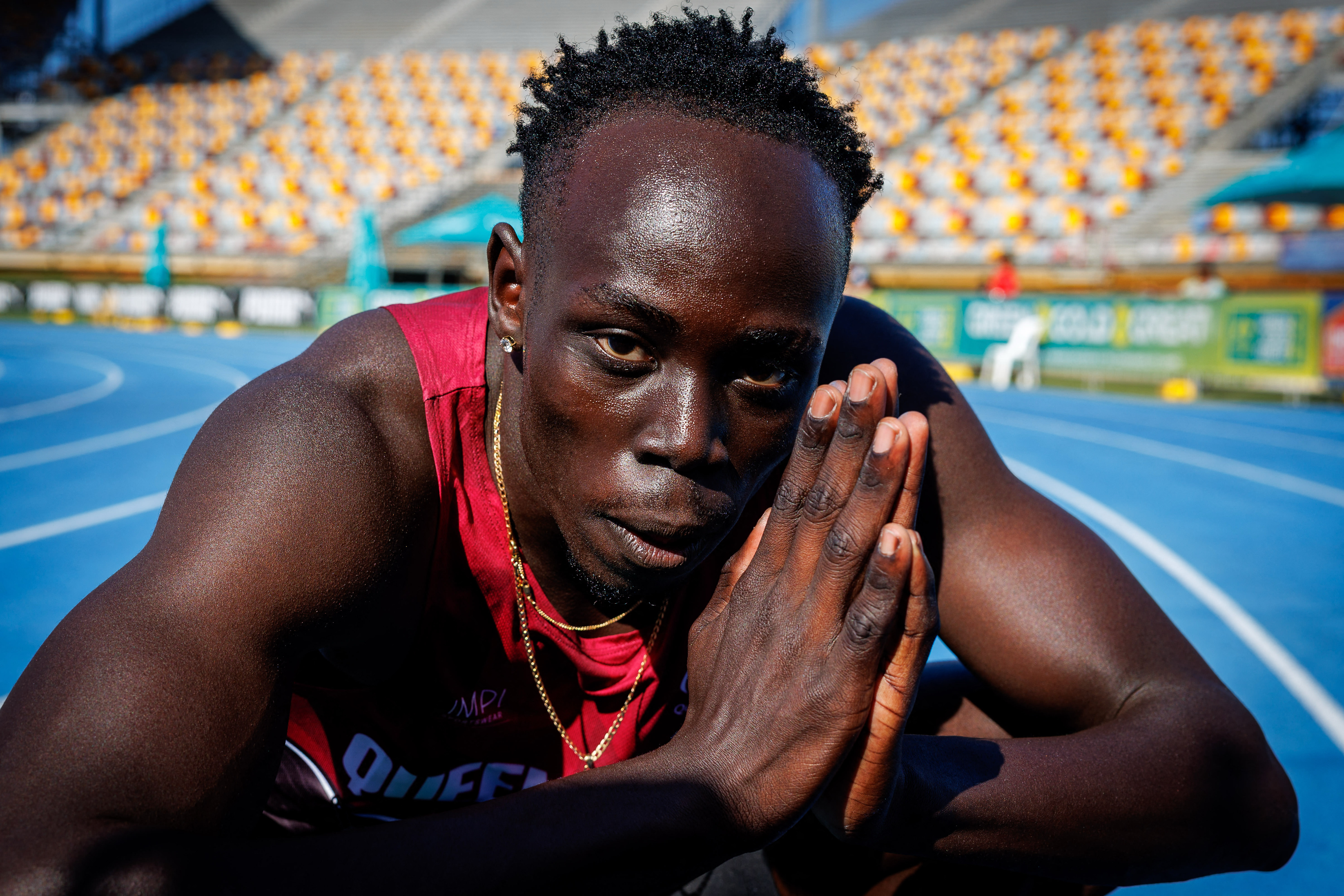 Gout Gout of Australia celebrates after winning the 100m final.