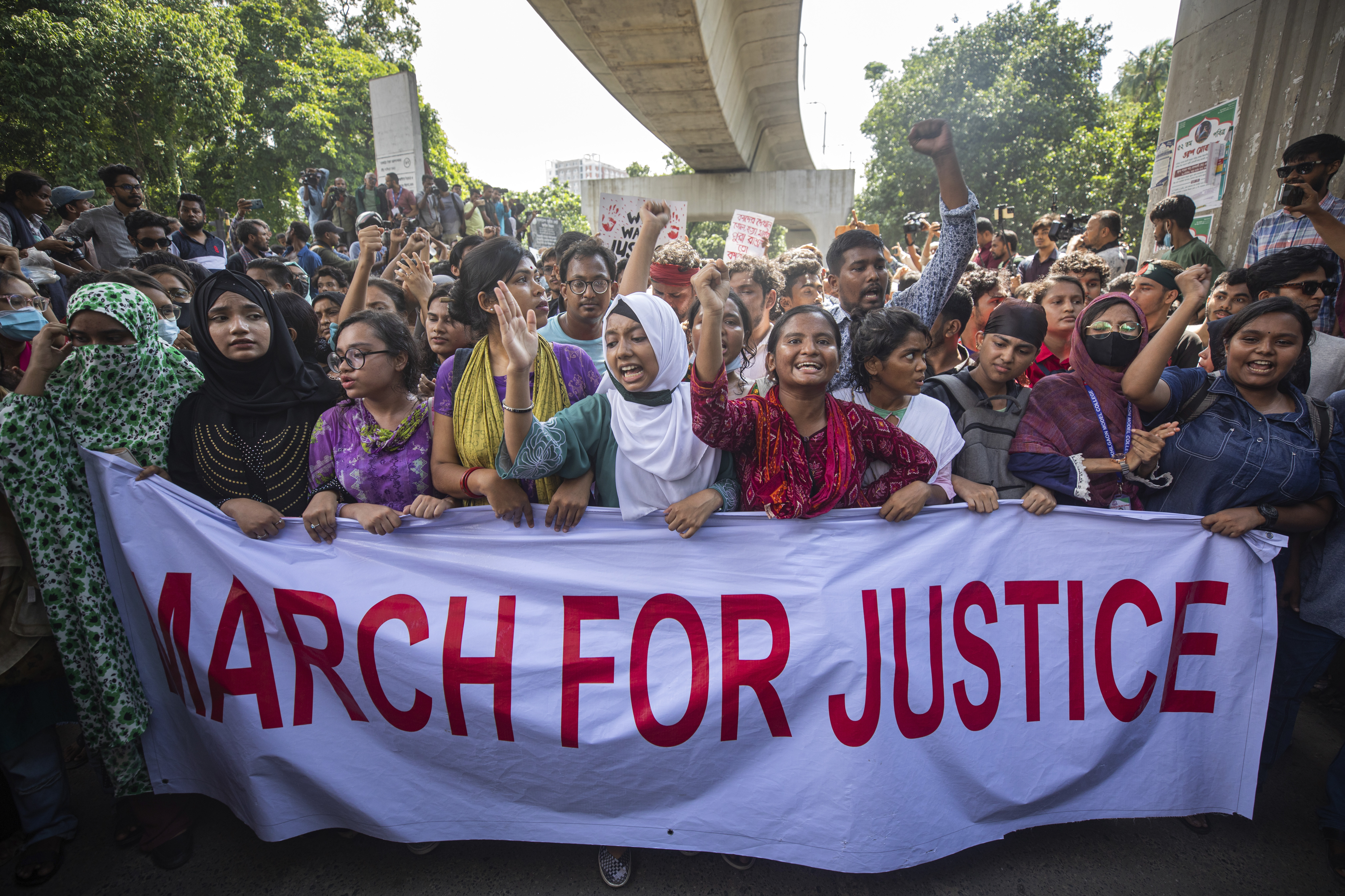 University students shout slogans during a protest to demand justice for the victims killed in the recent countrywide deadly clashes