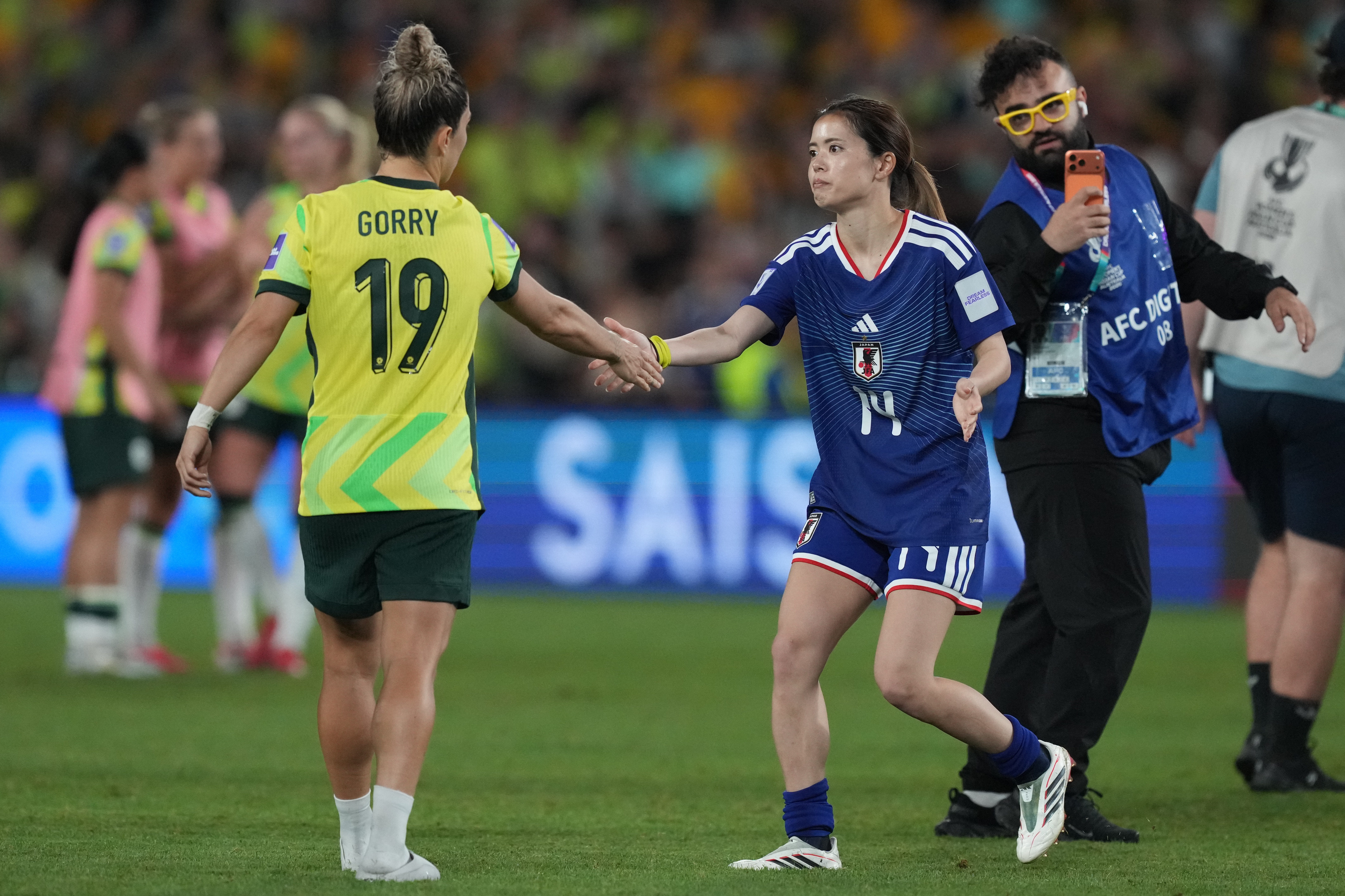 Japan's Yui Hasegawa and Australia's Katrina Gorry shake hands after the Women's Asian Cup soccer final between Japan and Australia