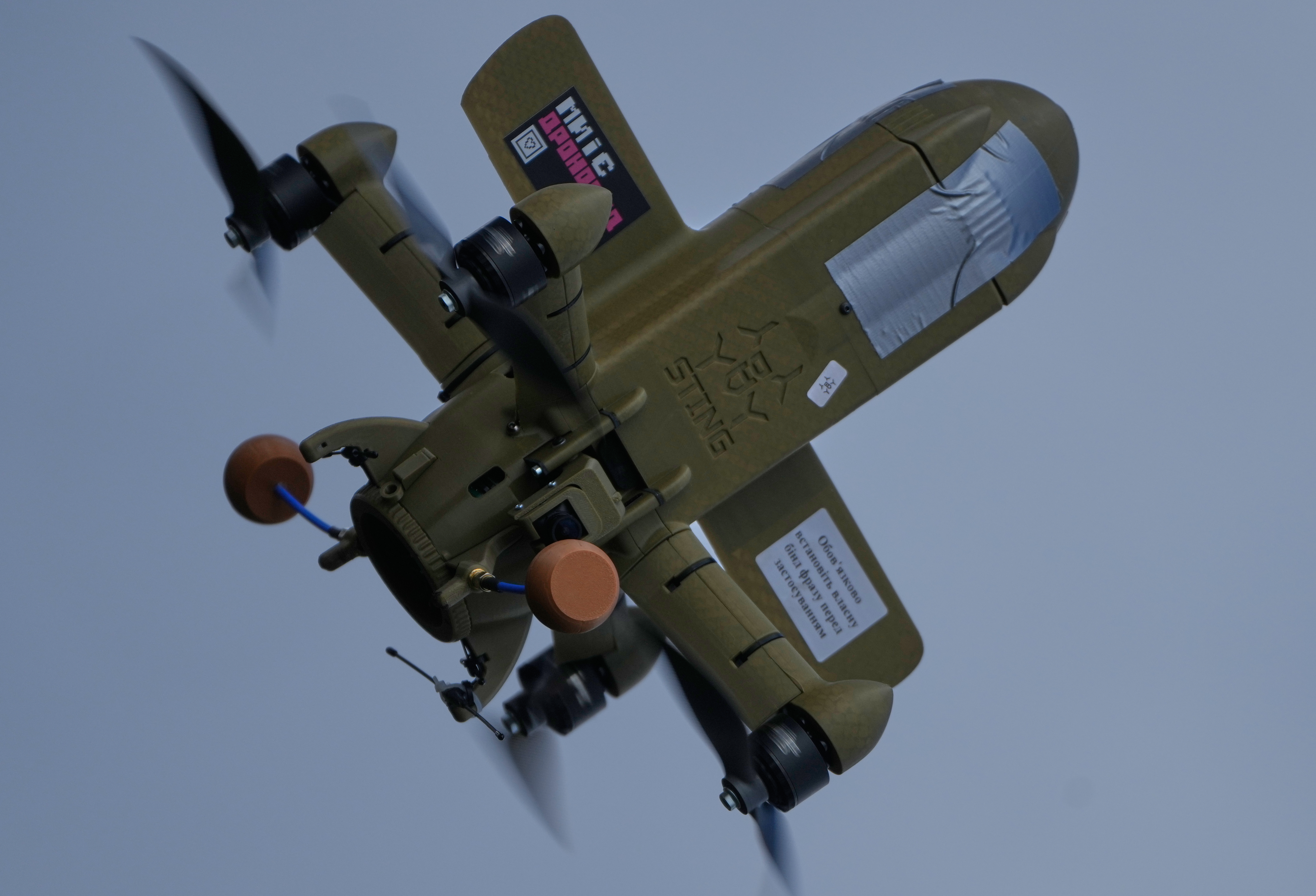 FILE - A Sting interceptor drone flies during drills at the Yatagan School for Unmanned Aerial Systems in the Kyiv region, Ukraine, on March 19, 2026. (AP Photo/Efrem Lukatsky, File)