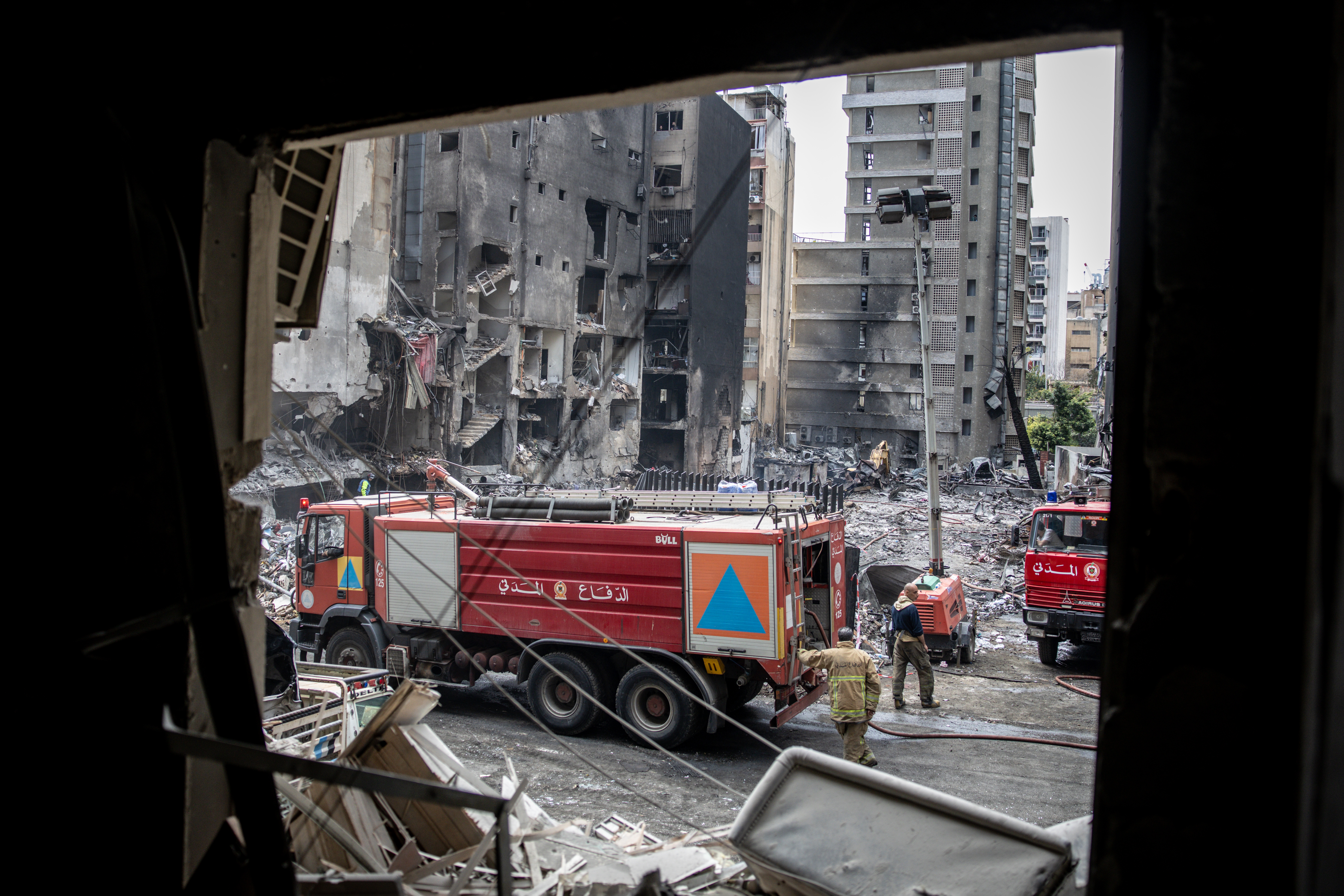 Emergency services continue to clear and search rubble from a building destroyed on April 08 in an Israeli airstrike