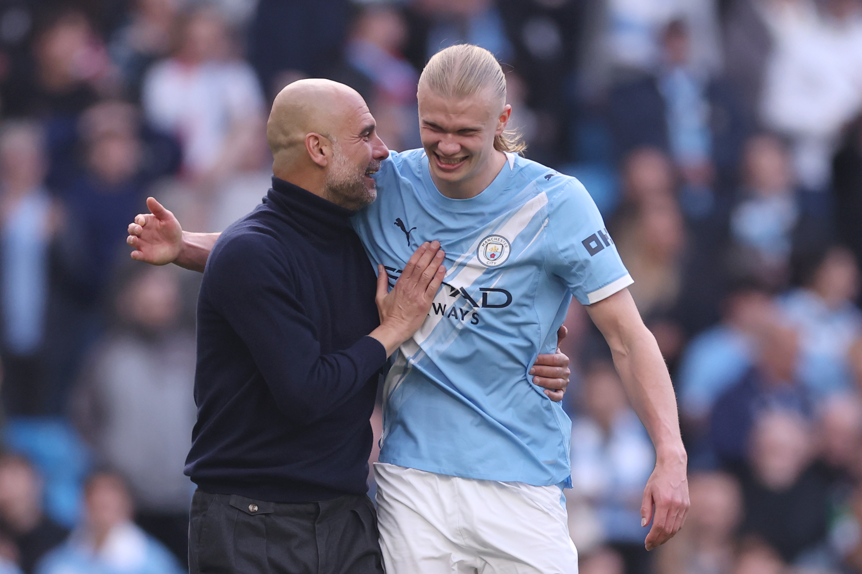 MANCHESTER, ENGLAND - APRIL 19: Pep Guardiola, Manager of Manchester City, and Erling Haaland celebrate victory following the Premier League match between Manchester City and Arsenal at Etihad Stadium on April 19, 2026 in Manchester, England. (Photo by Carl Recine/Getty Images)