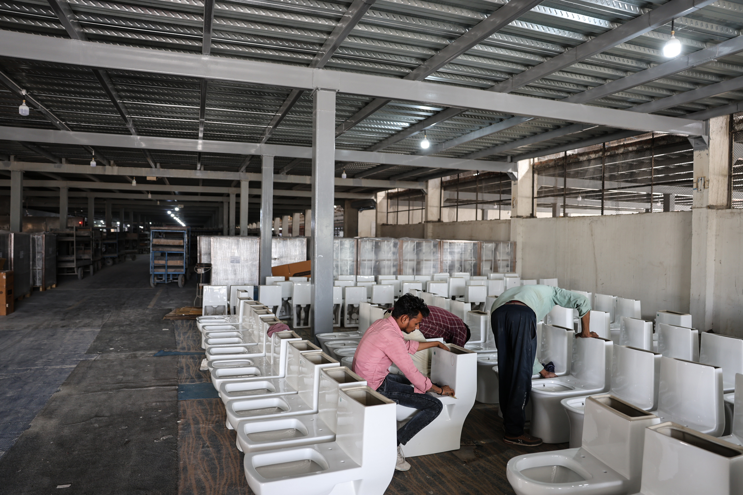 A worker seen inside a ceramics factory.