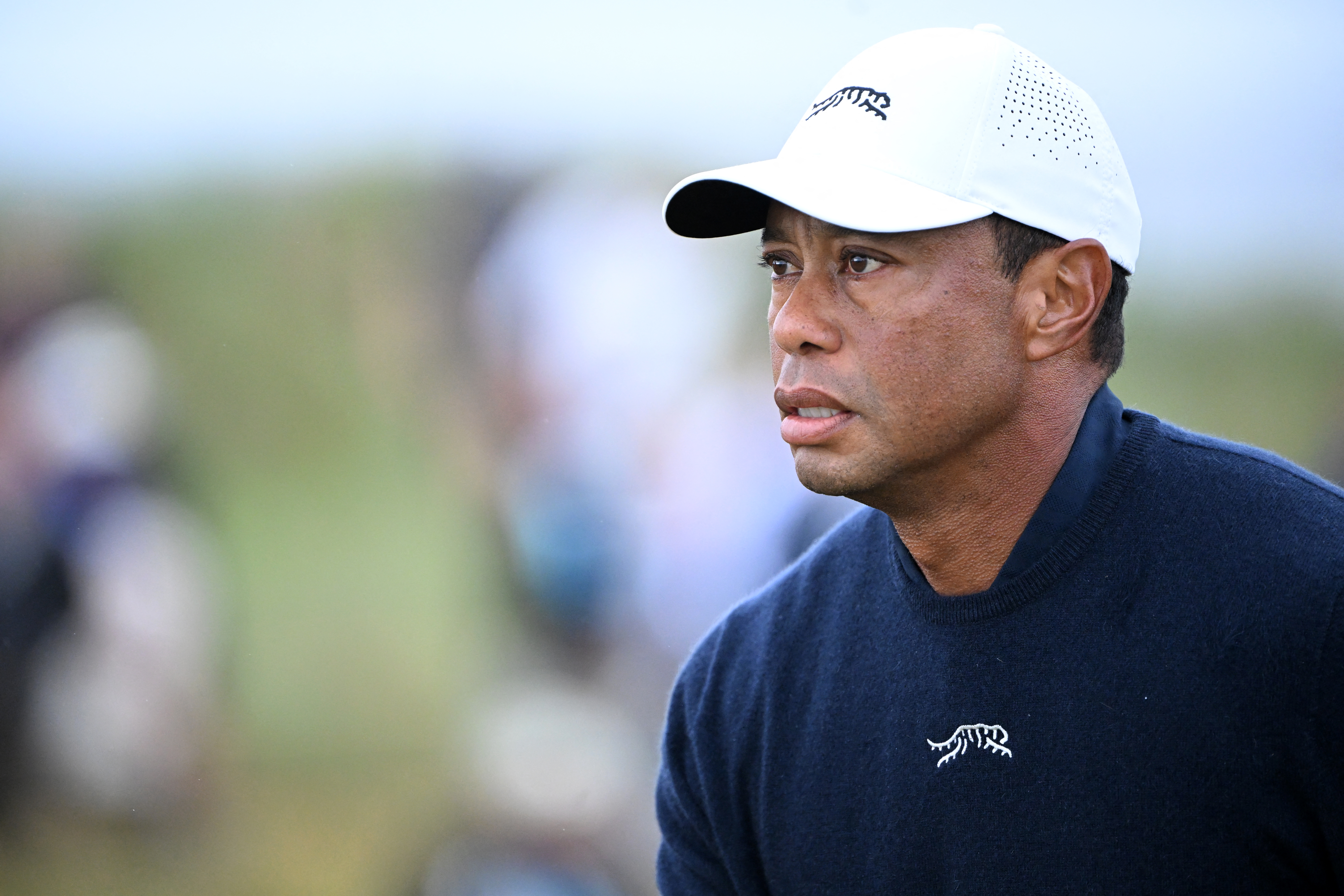 (FILES) US golfer Tiger Woods reacts after driving from the 4th tee during his second round, on day two of the 152nd British Open Golf Championship at Royal Troon on the south west coast of Scotland on July 19, 2024.