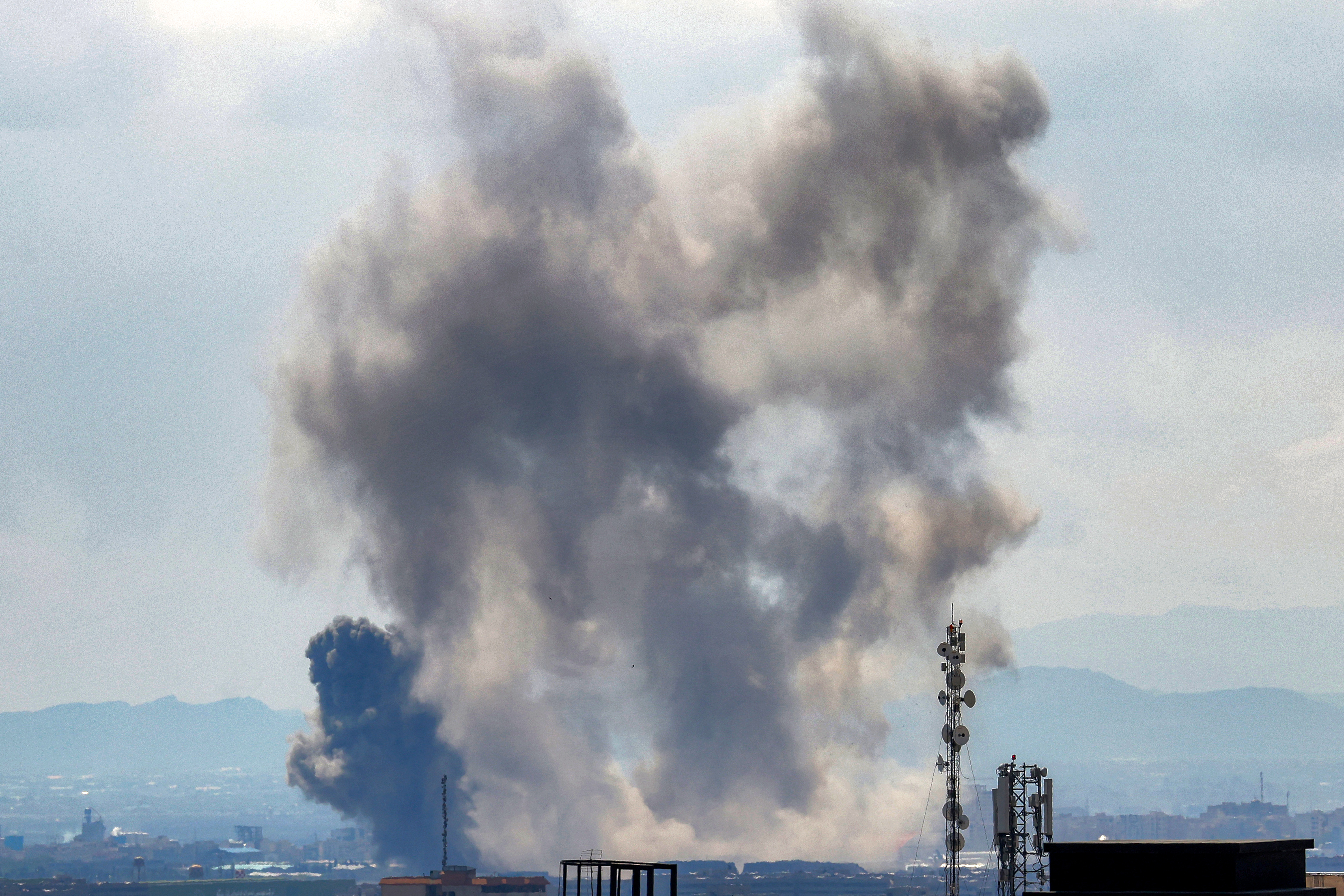 Smoke rises following strikes on Tehran on April 7, 2026.