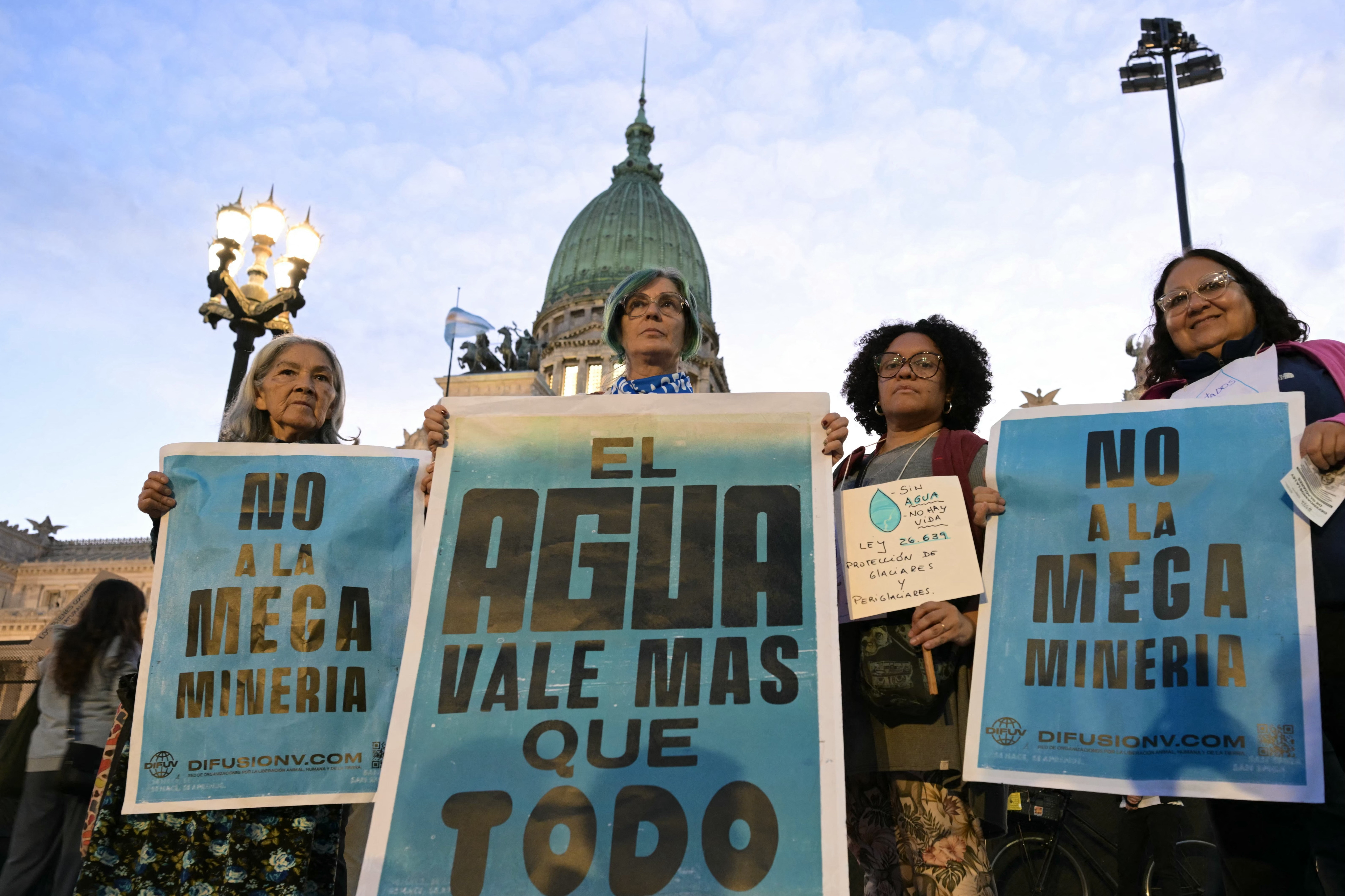Demonstrators pose during a protest against the modifications of the Glaciers Law in front of the Congress building in Buenos Aires, on April 8, 2026.