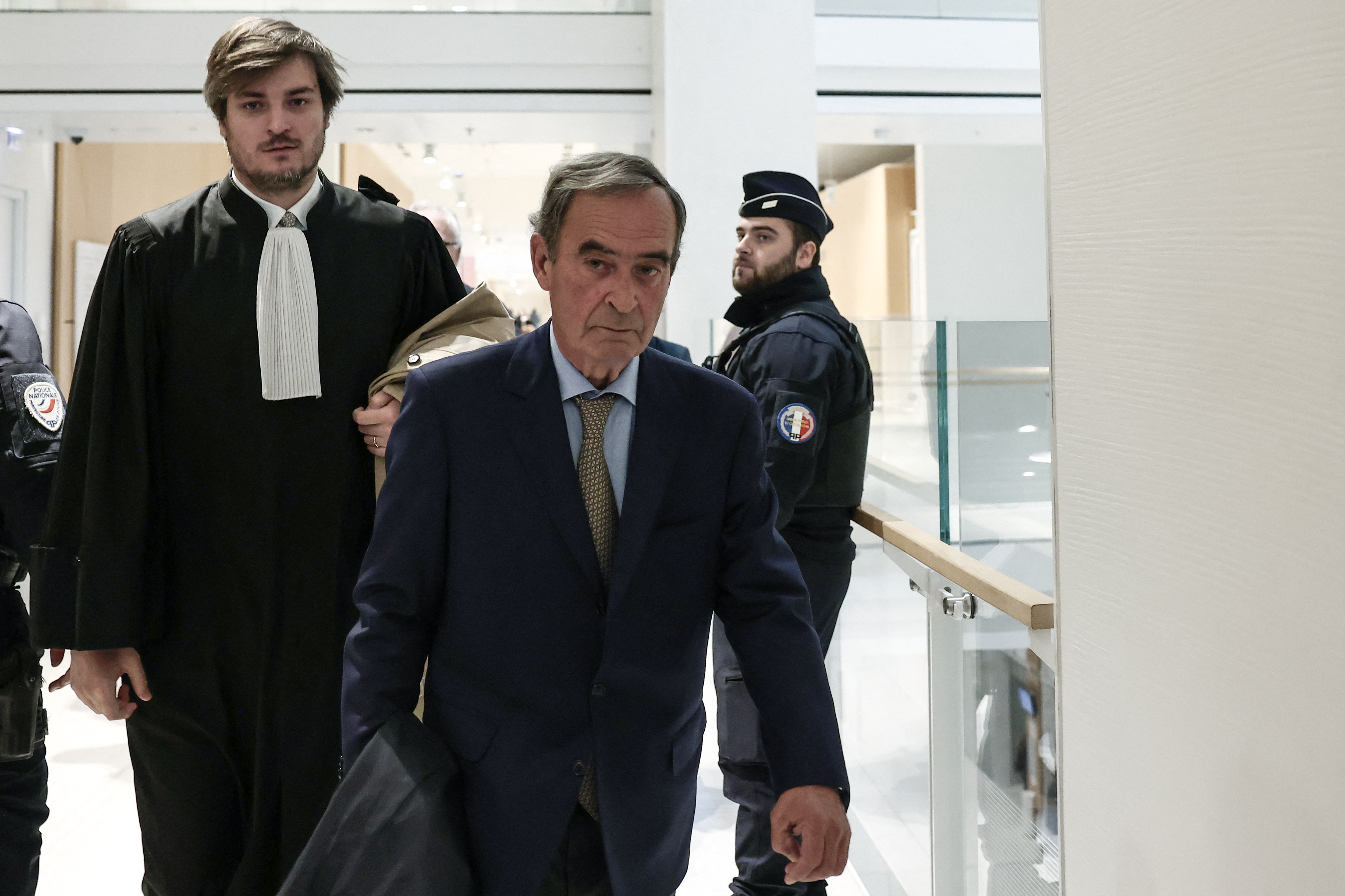 Former CEO of Lafarge Bruno Lafont arrives on the day of the verdict in the trial of the French cement group Lafarge accused of financing terrorism in Syria, at the Paris courthouse, in Paris on April 13, 2026.