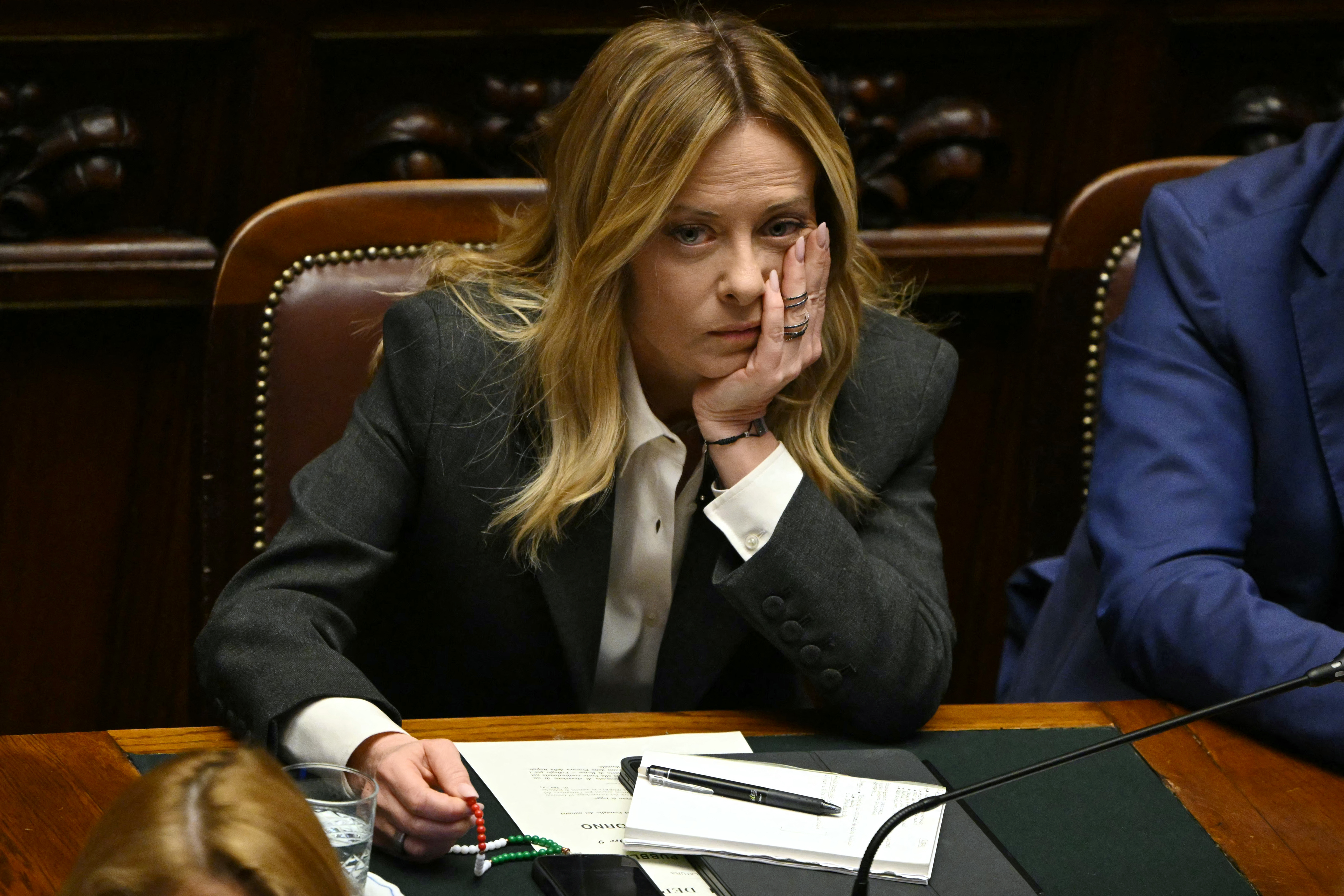 Italy's Prime Minister, Giorgia Meloni listens to the secretary of the Democratic Party (PD) Elly Schlein at the lower house of the Italian Parliament, in Rome on April 9, 2026. (Photo by Andreas SOLARO / AFP)