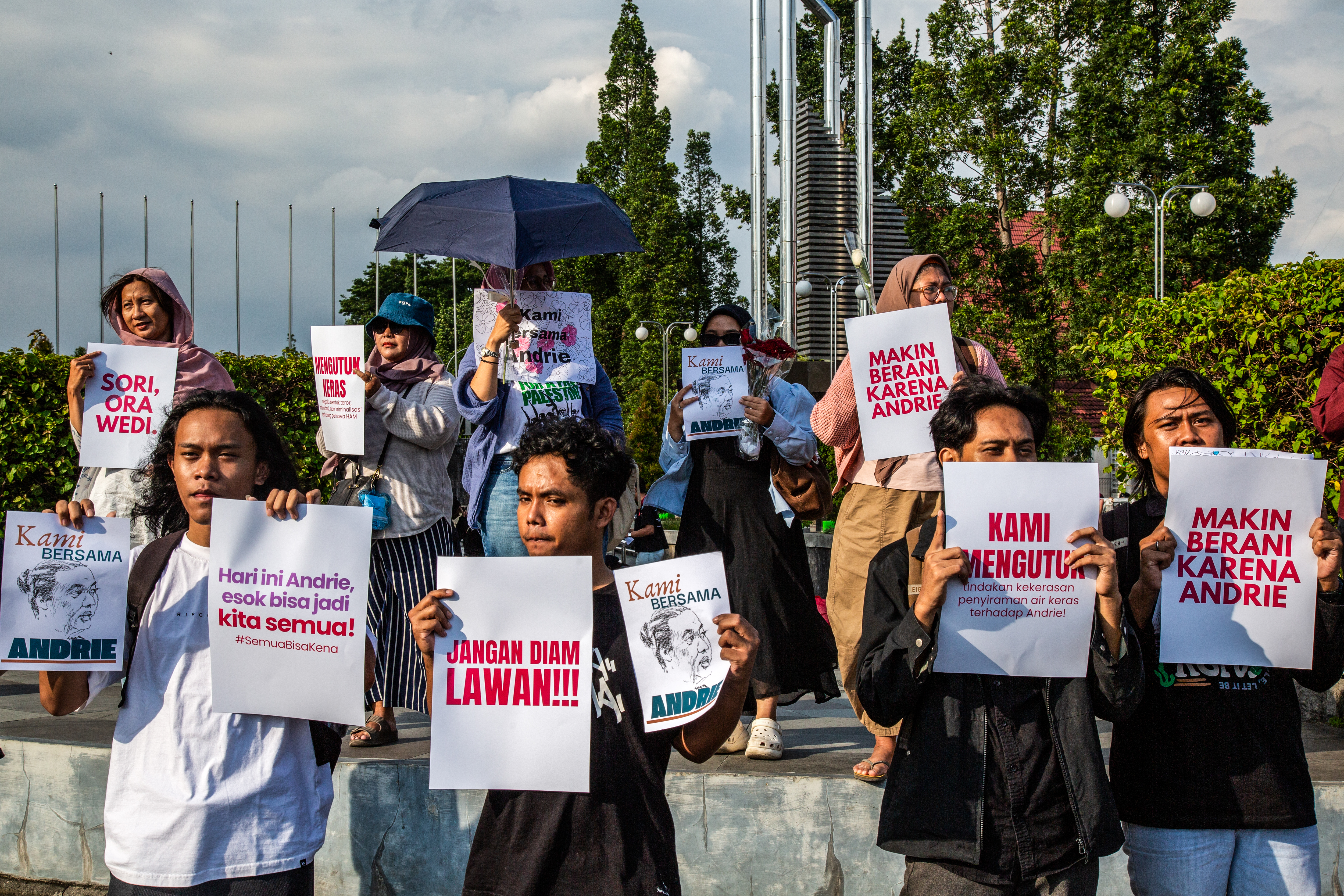 (FILES) Activists hold posters during a demonstration in support of Andrie Yunus, a staff member of Indonesian human rights NGO KontraS (Commission for the Disappeared and Victims of Violence), who was attacked with acid by an unidentified person, in Yogyakarta, March 14, 2026.