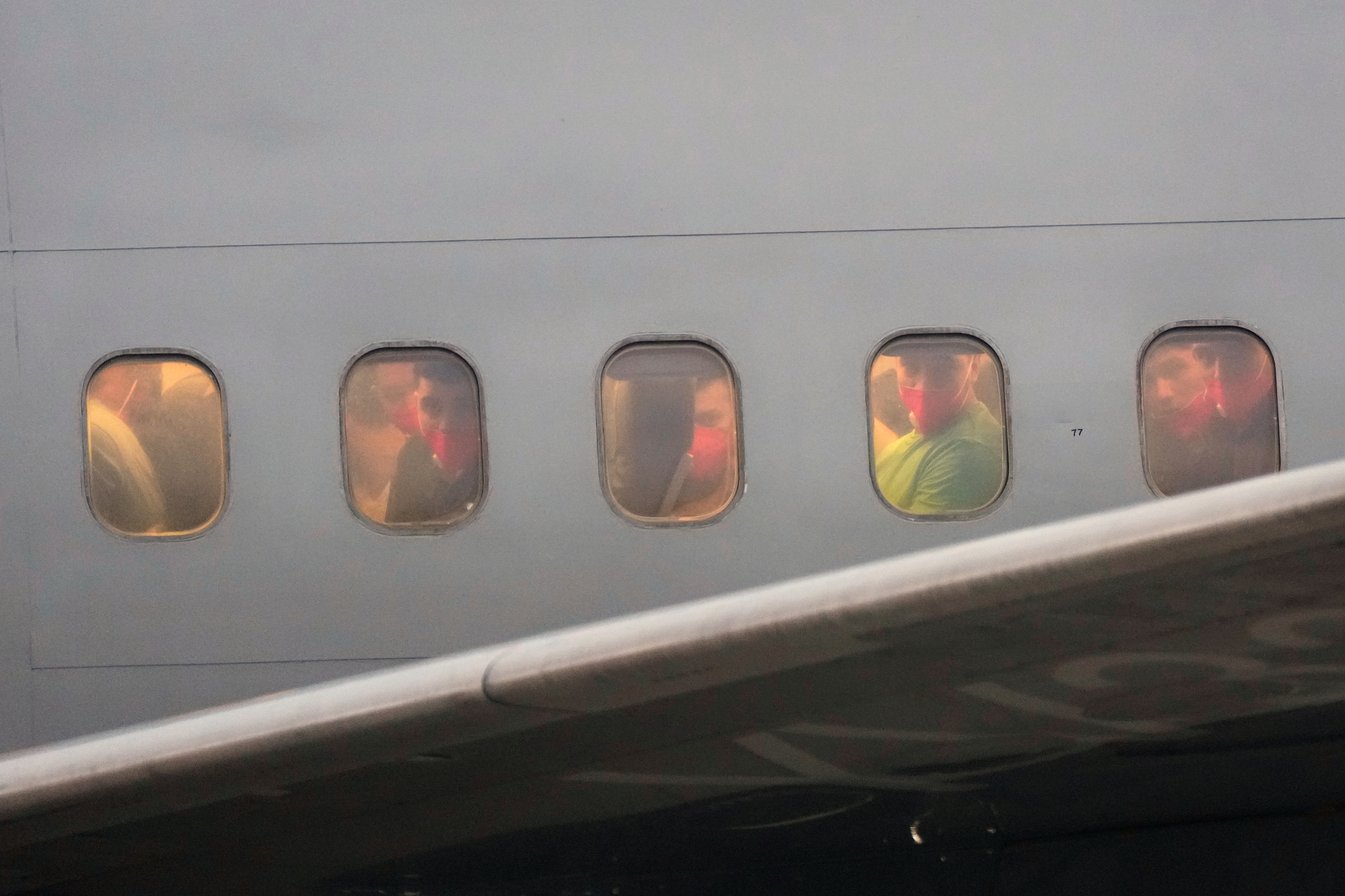 FILE - Migrants deported months ago by the United States to El Salvador under the Trump administration's immigration crackdown arrive at Simon Bolívar International Airport, in Maiquetia, Venezuela, July 18, 2025. (AP Photo/Ariana Cubillos, File)