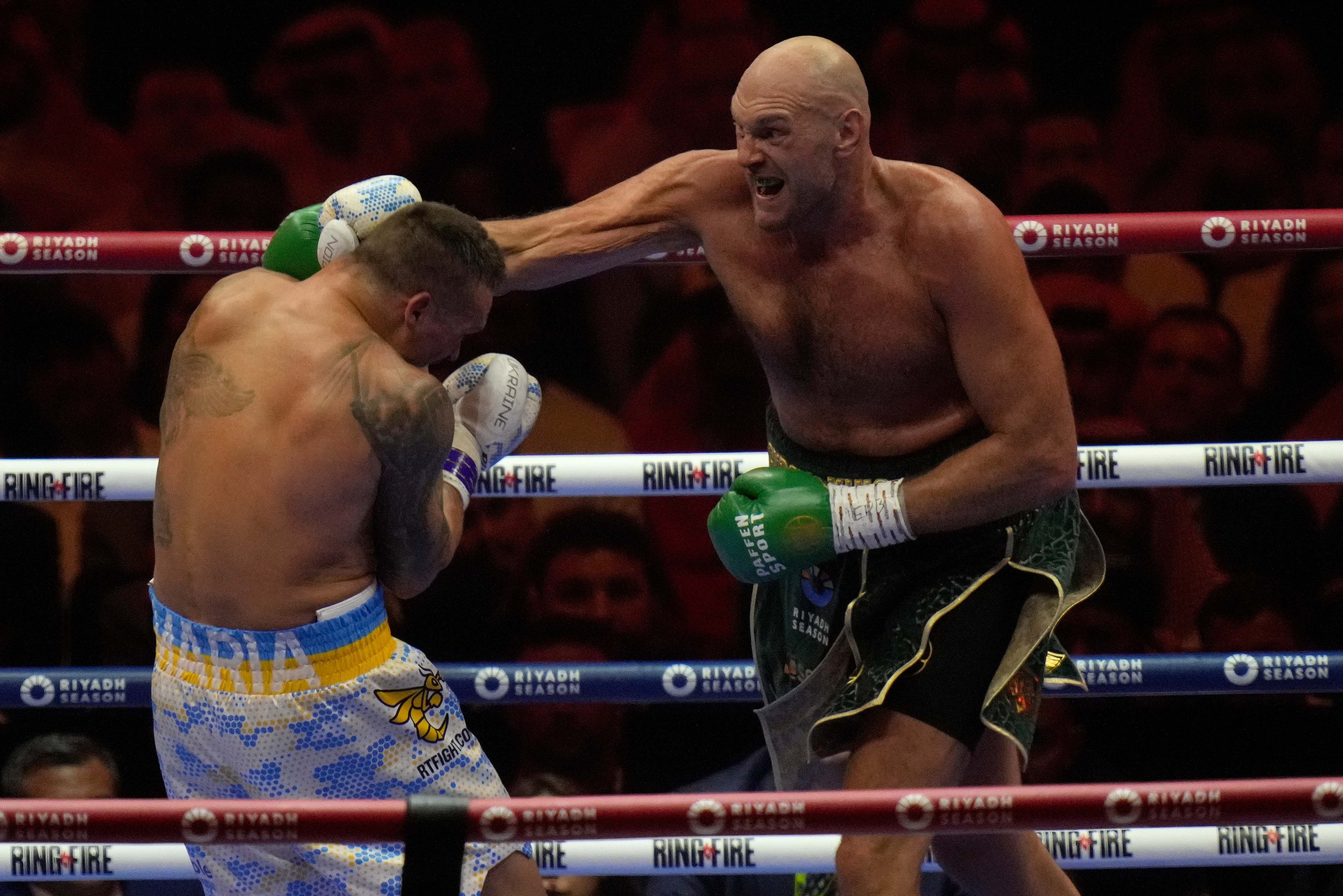 FILE - Britain's Tyson Fury, right, punches Ukraine's Oleksandr Usyk during their undisputed heavyweight world championship boxing fight at the Kingdom Arena in Riyadh, Saudi Arabia, on May 19, 2024. (AP Photo/Francisco Seco, File)