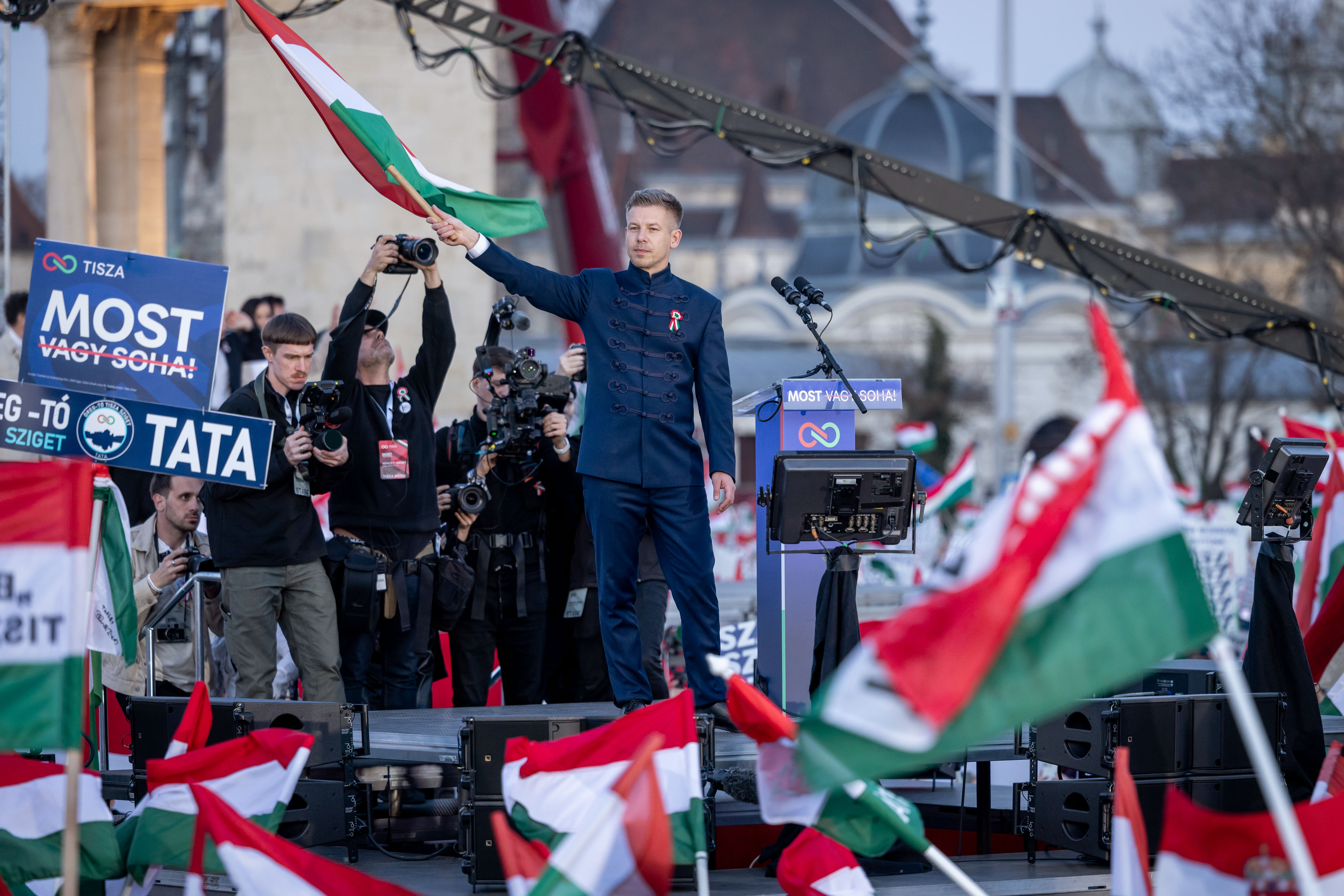 BUDAPEST, HUNGARY - MARCH 15: Peter Magyar, Hungarian opposition, leader of the 'TISZA' (Respect and Freedom) party, delivers a speech at a demonstration during commemorations of the 178th anniversary of the 1948/49 Hungarian Revolution on March 15, 2026 in Budapest, Hungary. A rally by Fidesz party supporters of Viktor Orban, Hungary's long-serving prime minister, is taking place alongside a demonstration led by Peter Magyar, leader of the Tisza party, and Orban's main challenger in the upcoming parliamentary elections scheduled for April 12. The 1848 Hungarian Revolution sought independence from Austria through a peaceful movement, standing apart from the many European Revolutions of that same year. Despite its failure, it remains pivotal in Hungarian history, with its anniversary, March 15, being one of the nation's three national holidays. (Photo by Janos Kummer/Getty Images)