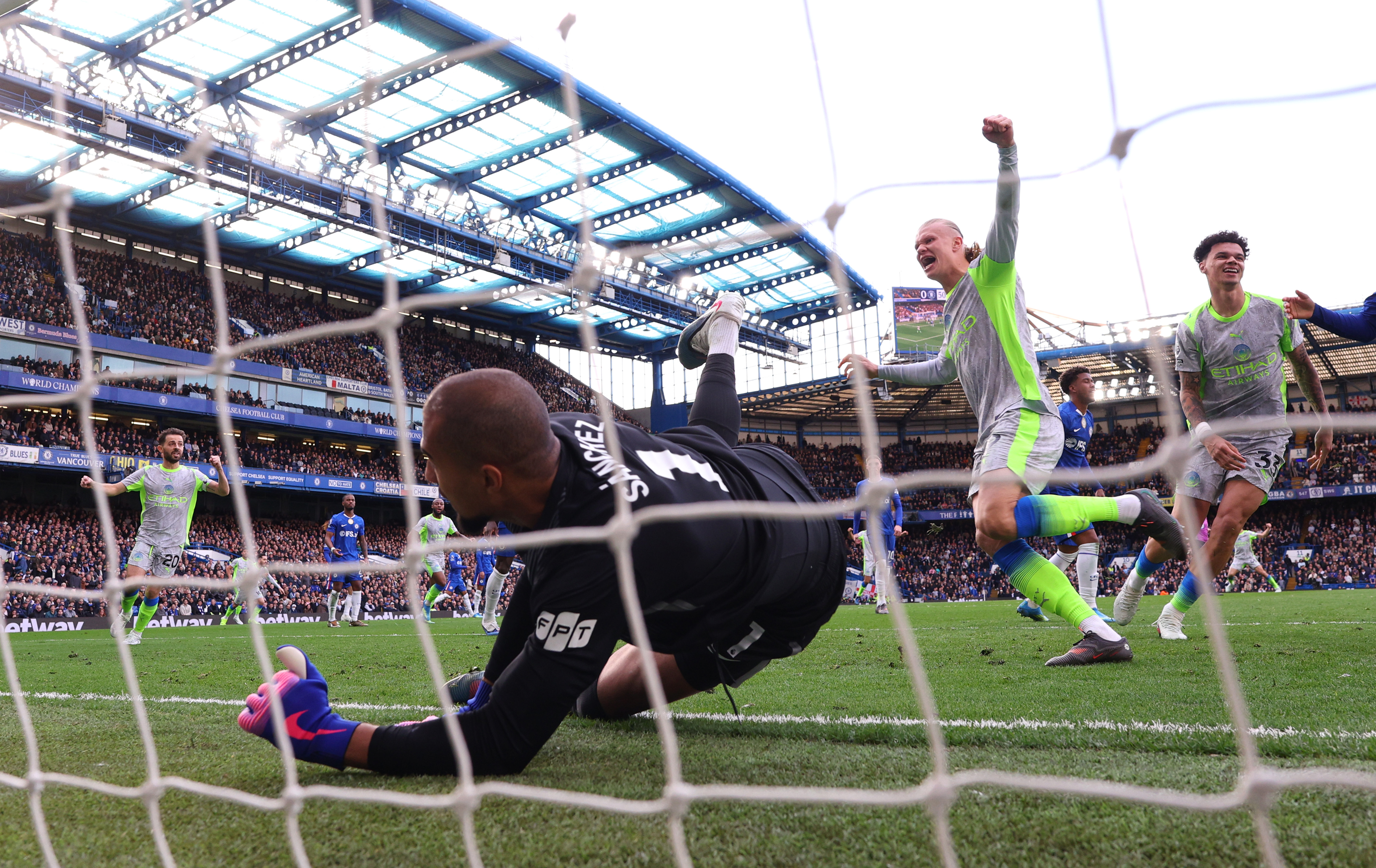 LONDON, ENGLAND - APRIL 12: Erling Haaland of Manchester City celebrates his side's first goal scored by Nico O'Reilly during the Premier League match between Chelsea and Manchester City at Stamford Bridge on April 12, 2026 in London, England. (Photo by Ryan Pierse/Getty Images)