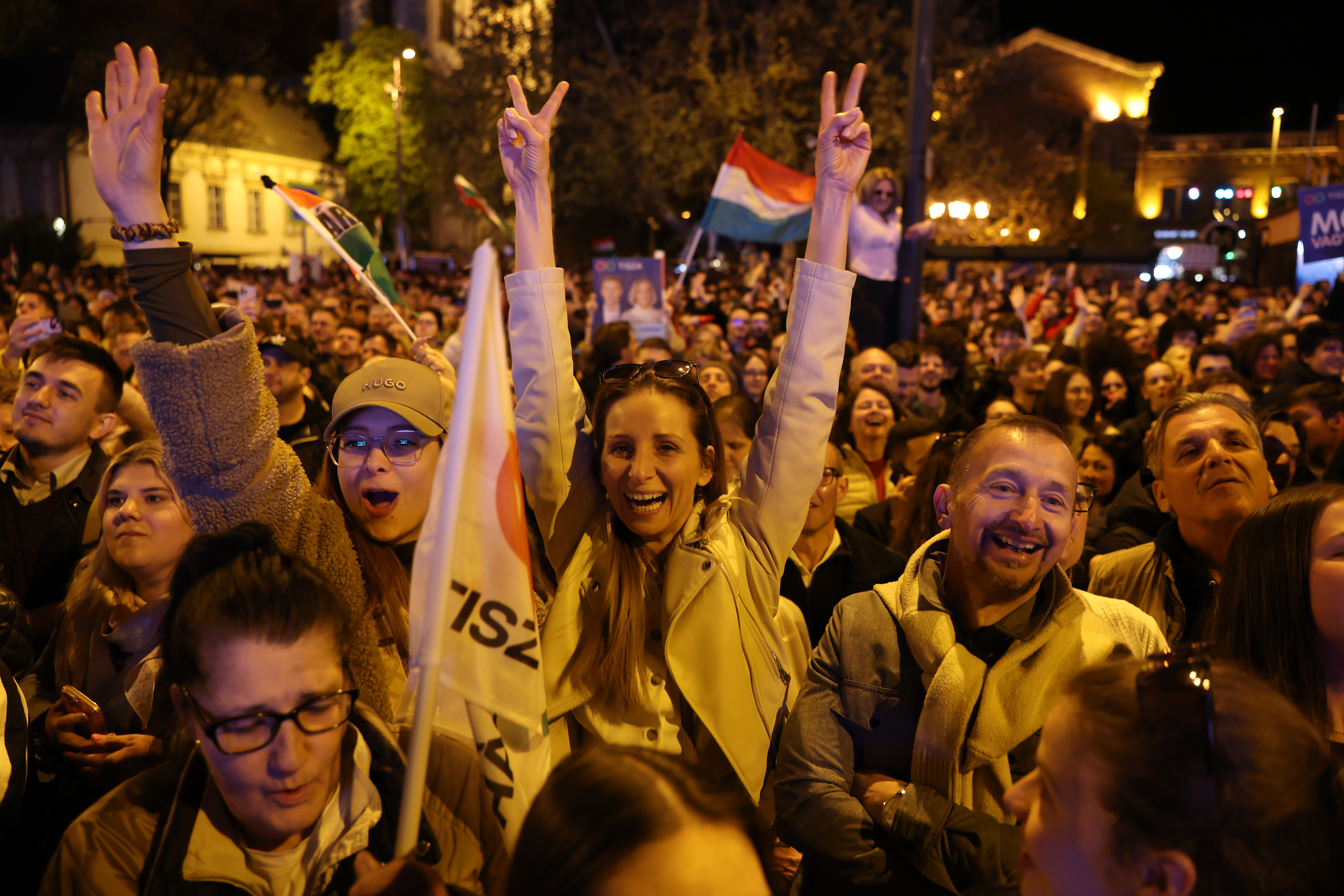 BUDAPEST, HUNGARY - APRIL 12: Revellers celebrate the resounding Tisza party win in Hungarian parliamentary elections on April 12, 2026 in Budapest, Hungary. Prime Minister Viktor Orban of the Fidesz party has conceded his party's election loss, paving the way for Peter Magyar, lead candidate of the Tisza party, to become the next prime minister. (Photo by Sean Gallup/Getty Images)