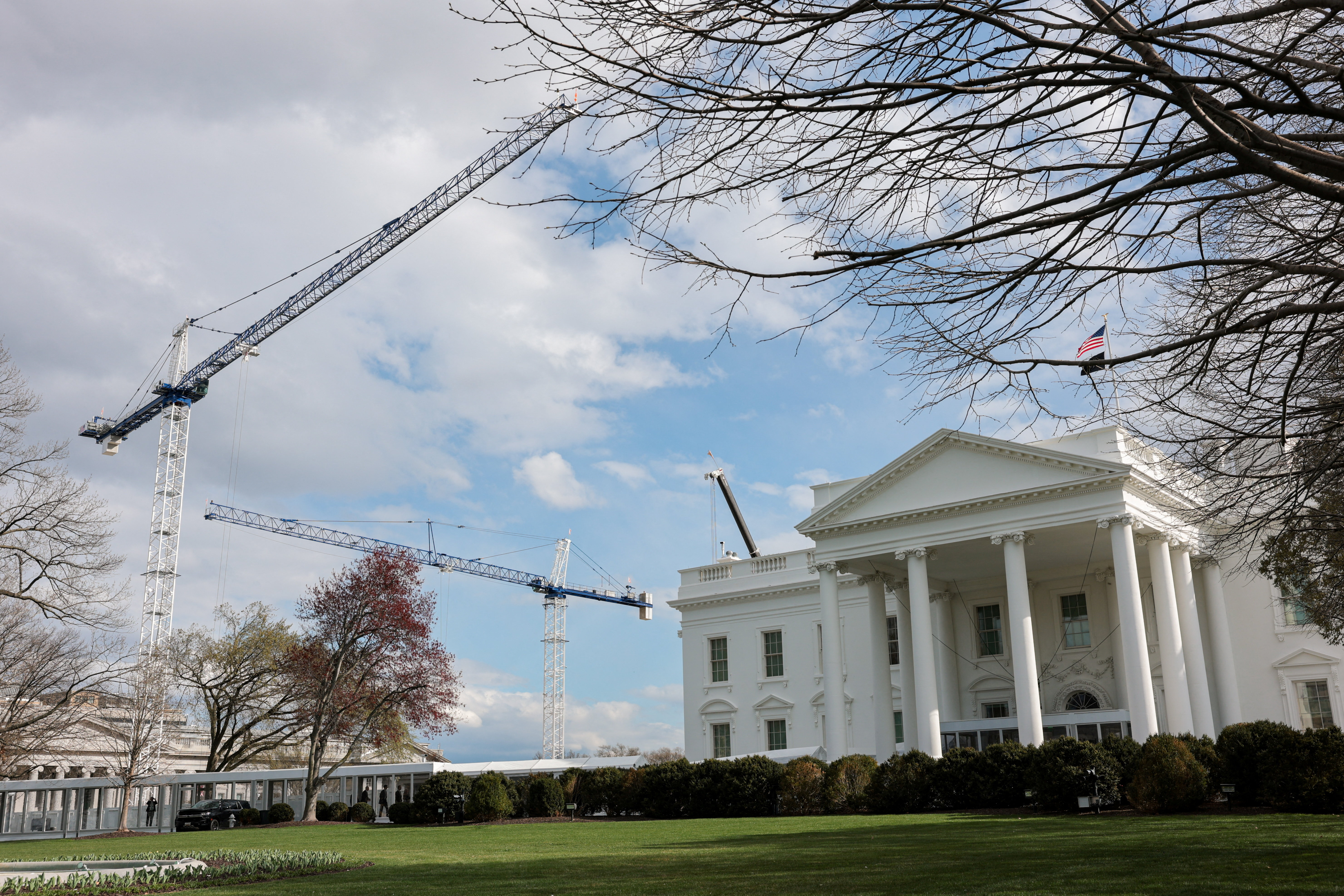 Construction cranes work on White House East Wing renovations in Washington, D.C., U.S., March 17, 2026. REUTERS/Kylie Cooper