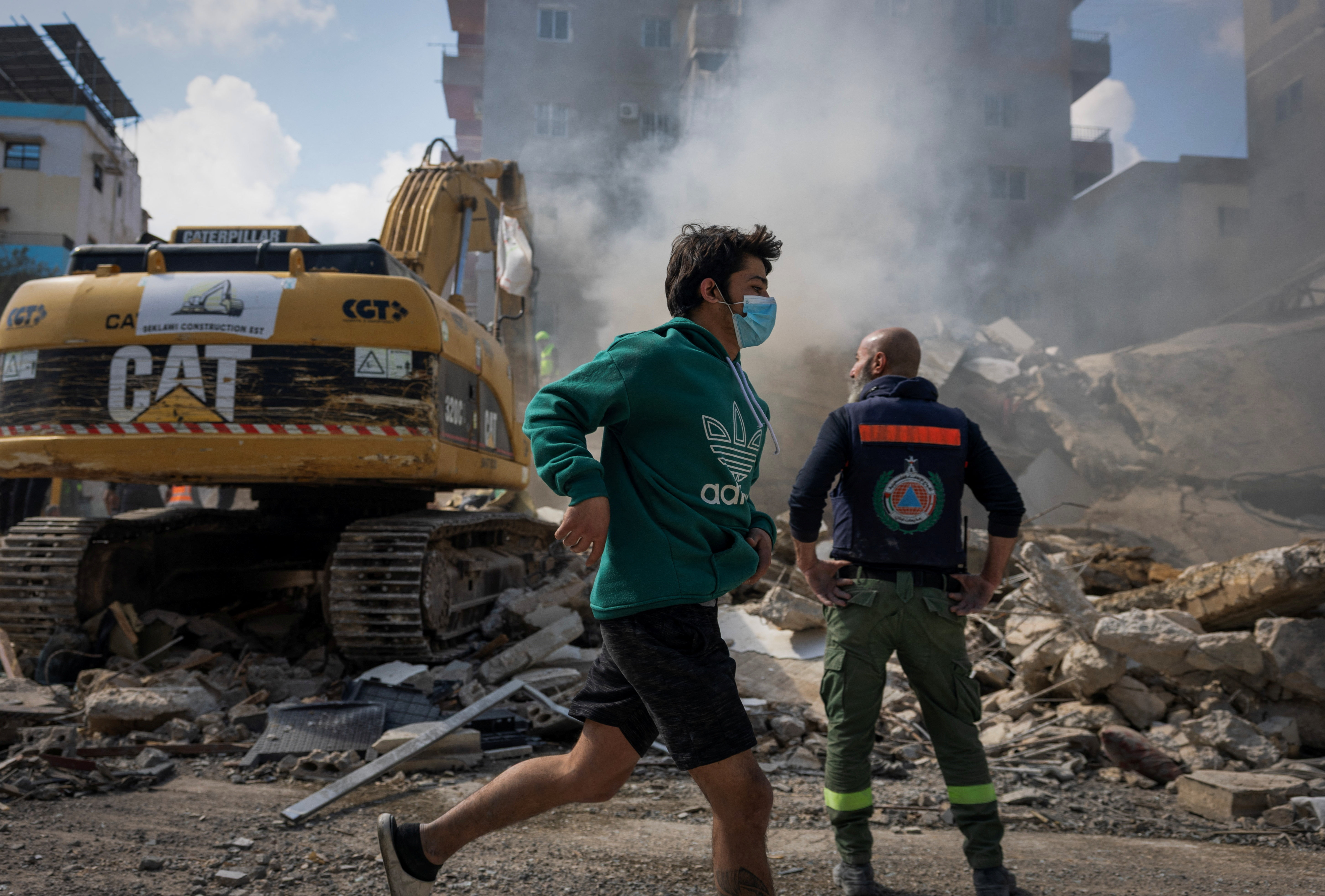 A boy runs past the site of an Israeli strike in Tyre, Lebanon, April 8, 2026. REUTERS/Adnan Abidi
