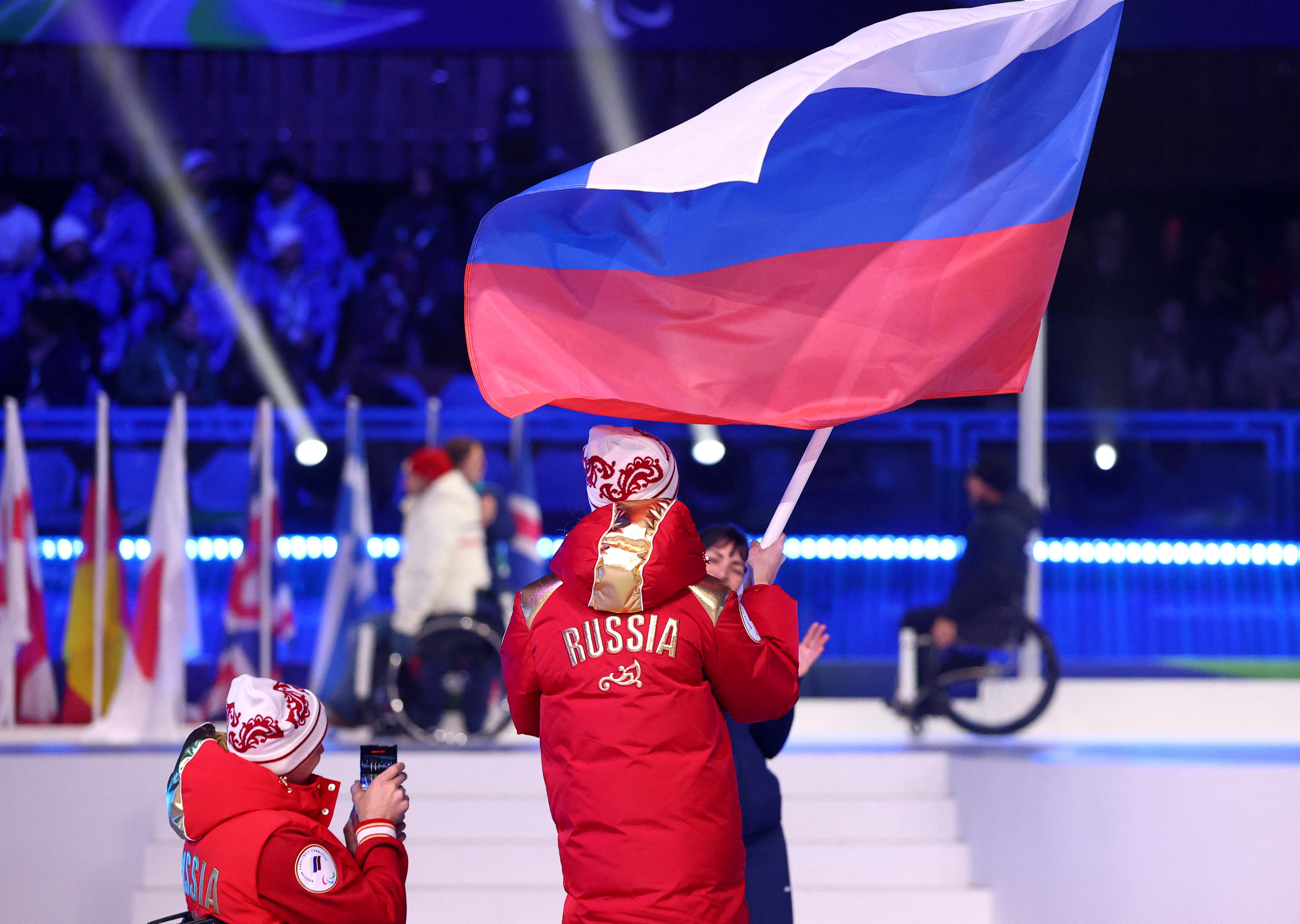 Milano Cortina 2026 Paralympics - Closing Ceremony - Cortina Curling Olympic Stadium, Cortina d'Ampezzo, Italy - March 15, 2026. Flagbearers Ivan Golubkov of Russia and Varvara Voronchikhina of Russia in the athletes parade during the closing ceremony REUTERS/Lisi Niesner