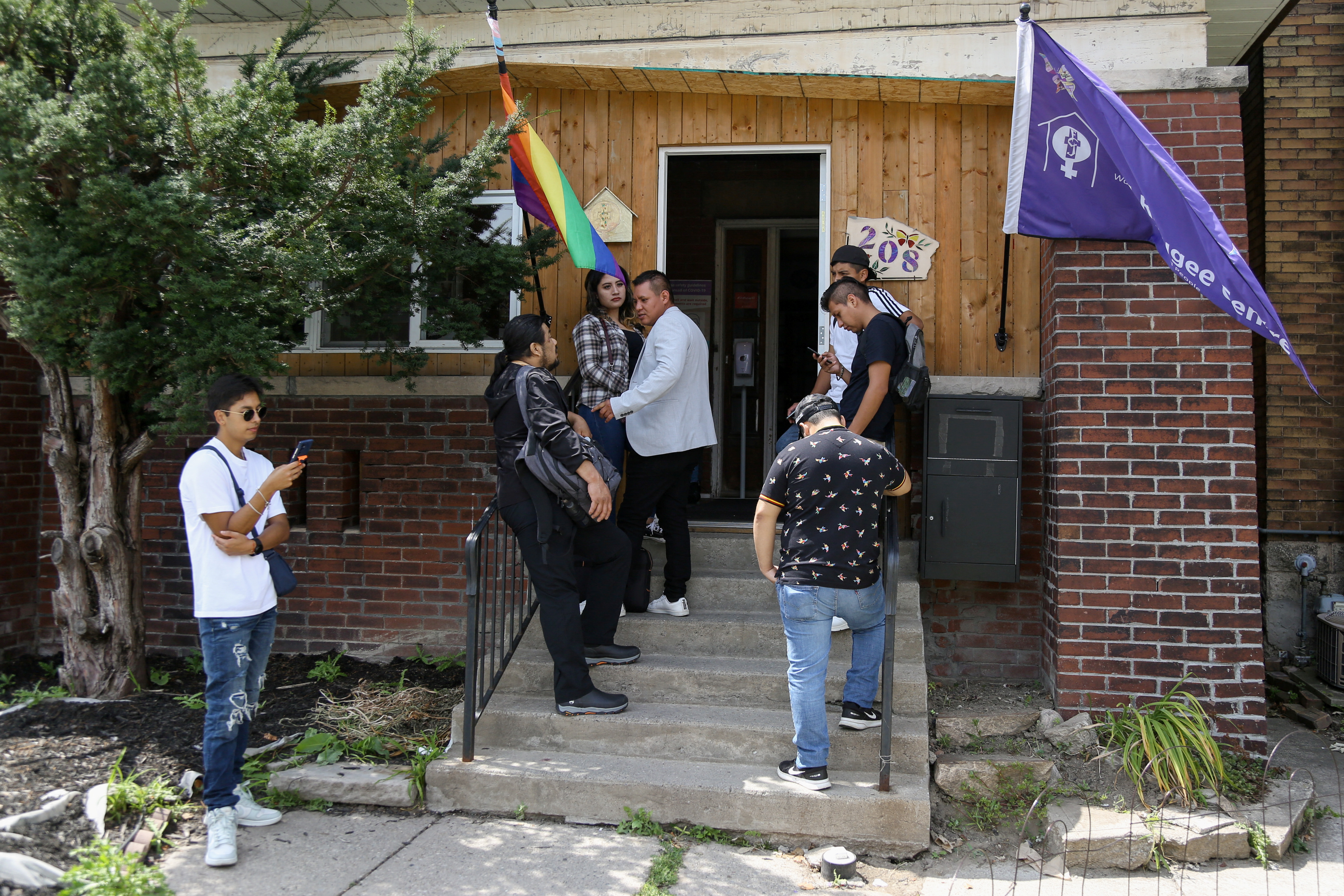People wait to seek help from the FCJ Refugee Centre in Toronto, Canada, August 7, 2023 [Wa Lone/Reuters]