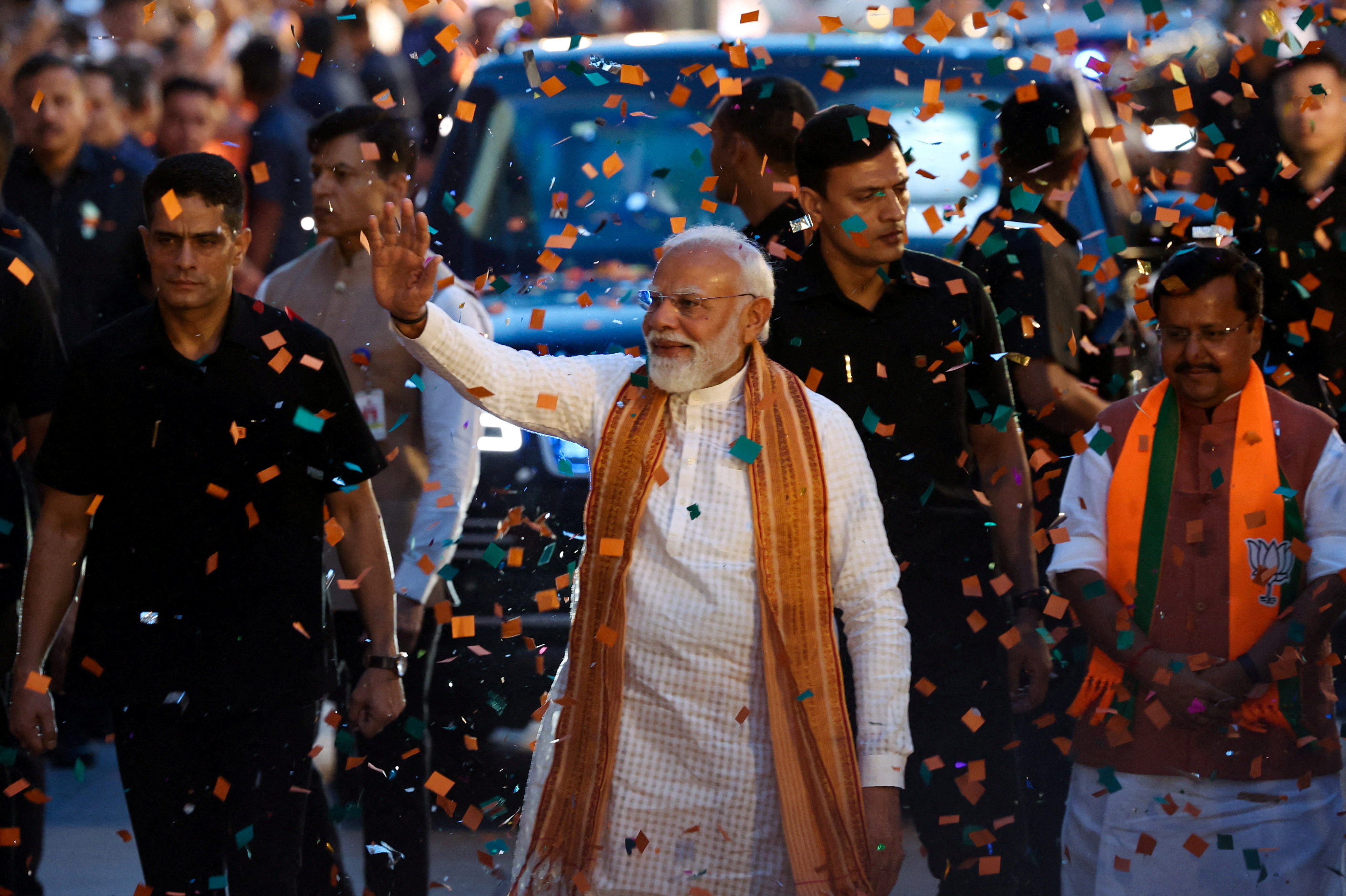 India’s PM Narendra Modi greets supporters as he arrives at the BJP headquarters after winning the West Bengal election, in New Delhi, India, May 4, 2026 [Reuters]