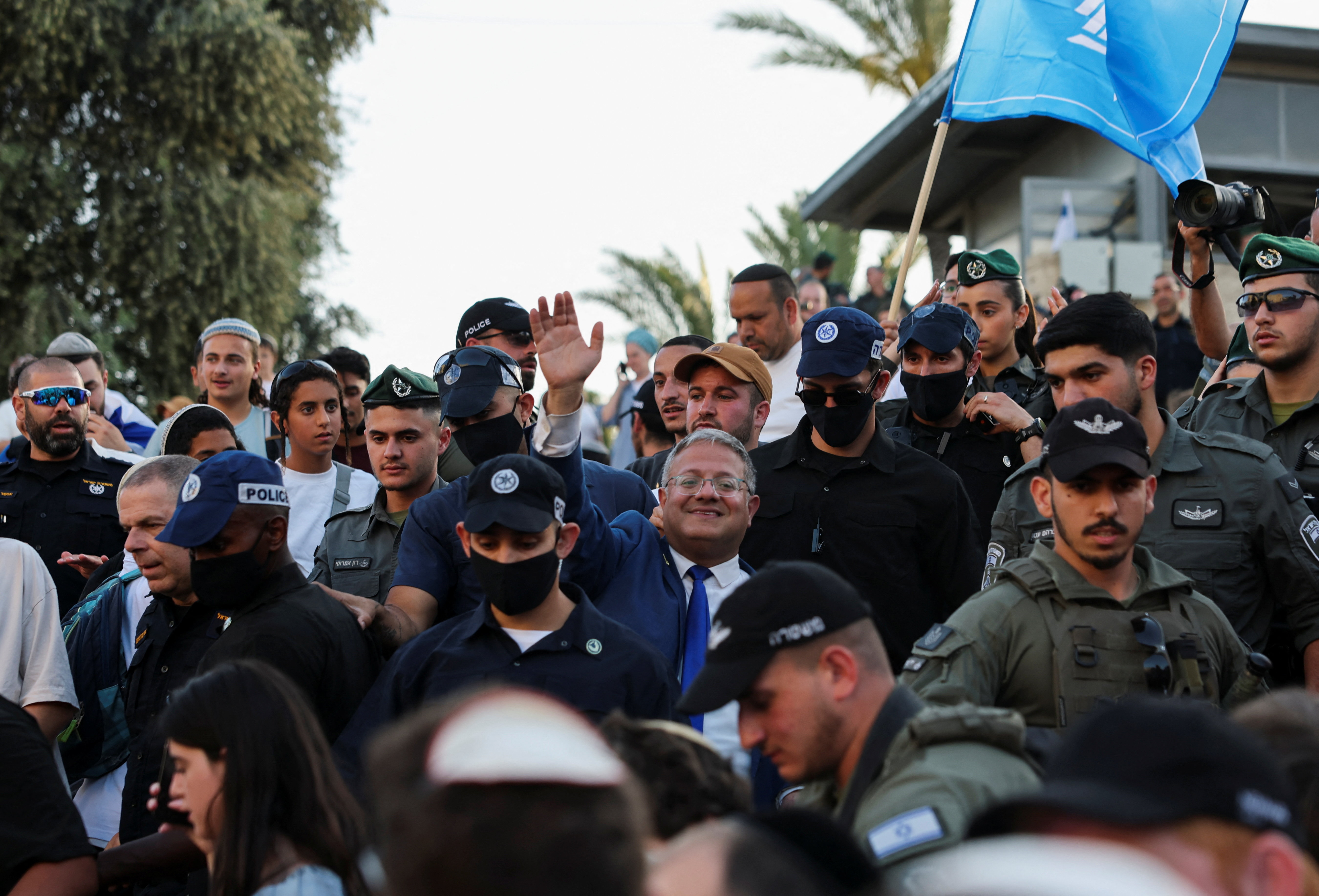 Israeli National Security Minister Itamar Ben-Gvir waves as people take part in the annual Jerusalem Day march in the Old City of Jerusalem, May 14, 2026