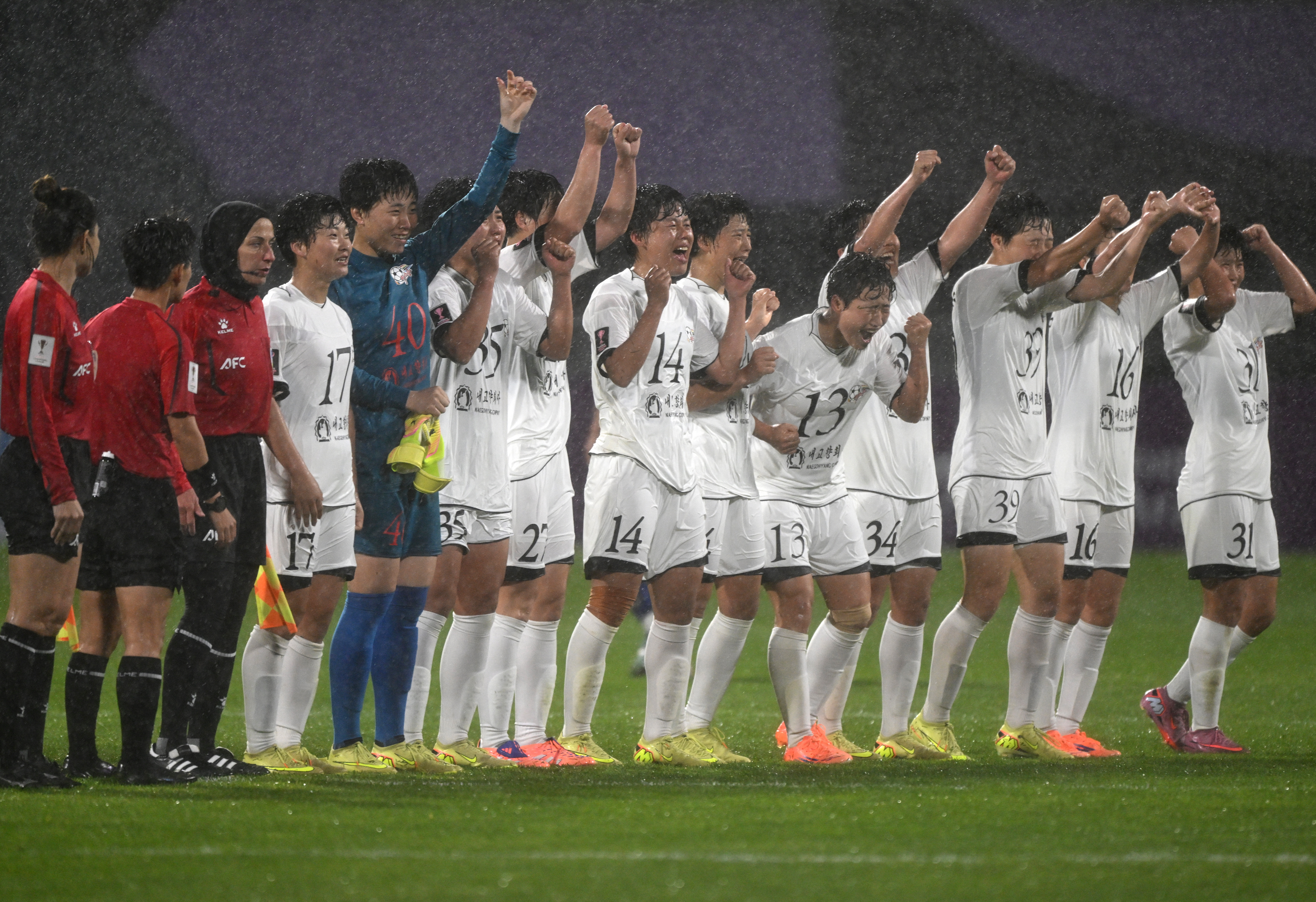 Naegohyang Women's FC players celebrate their victory after the AFC Women's Champions League semi-final football match between North Korea's Naegohyang Women's FC and South Korea's Suwon FC Women in Suwon on May 20, 2026. (Photo by Jung Yeon-je / AFP)