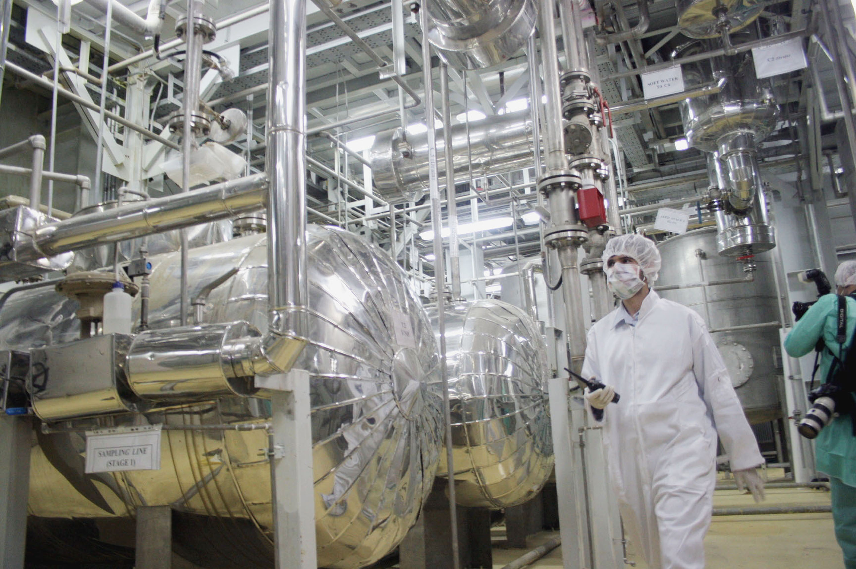ISFAHAN, IRAN - MARCH 30: A worker walks inside of an uranium conversion facility March 30, 2005 just outside the city of Isfahan, about 254 miles (410 kilometers), south of capital Tehran, Iran. The cities of Isfahan and Natanz in central Iran are home to the heart of Iran's nuclear program. The facility in Isfahan makes hexaflouride gas, which is then enriched by feeding it into centrifuges at a facility in Natanz, Iran. Iran's President Mohammad Khatami and the head of Iran's Atomic Energy Organisation Gholamreza Aghazadeh is scheduled to visit the facilities. (Photo by Getty Images)