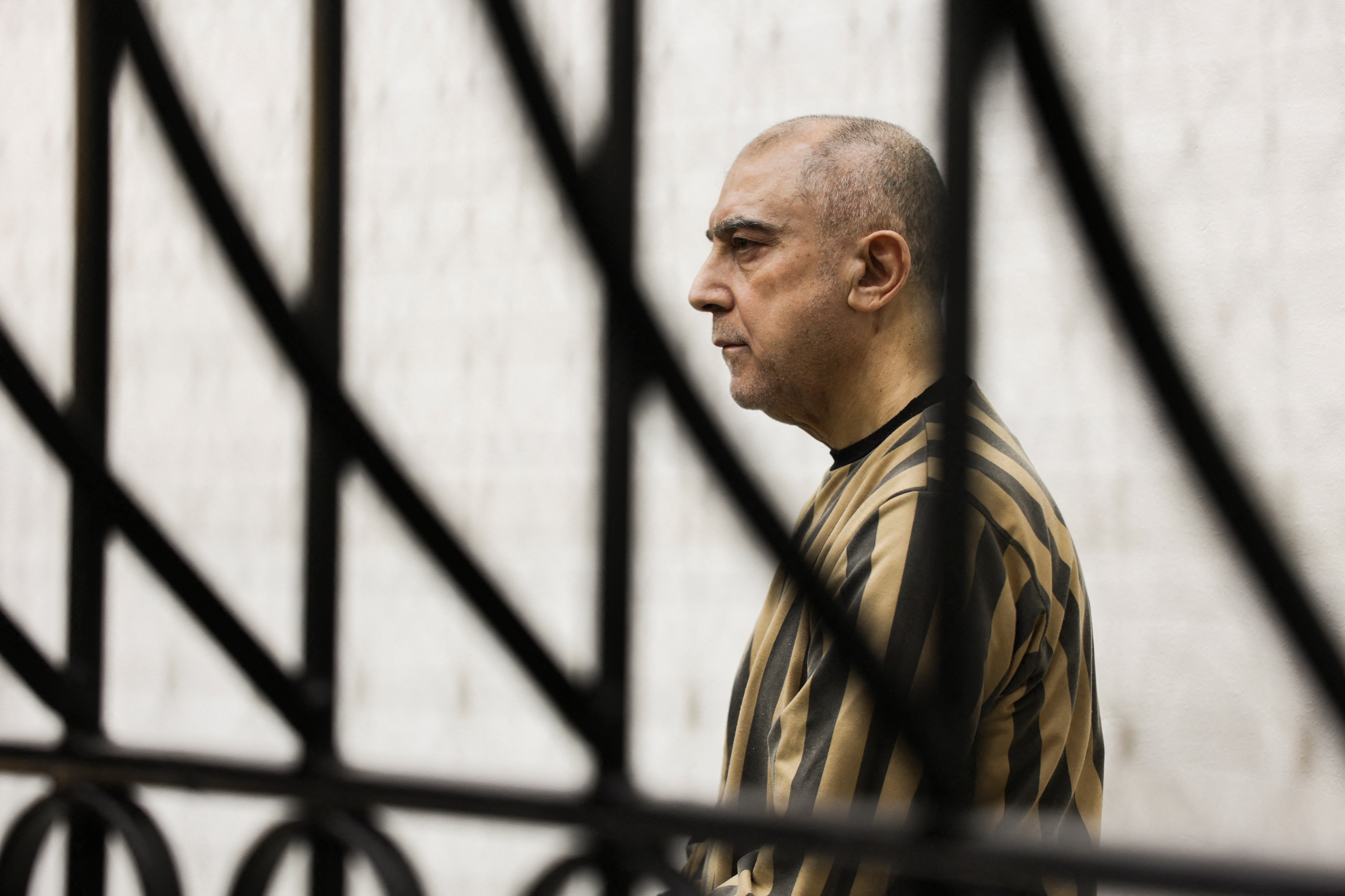 Atef Najib, a brigadier general and former head of the Political Security Department in Daraa during Syria's ousted President Bashar al-Assad's rule, who is accused of committing war crimes, attends a trial session at the Palace of Justice, in Damascus, Syria, April 26, 2026. [File: Khalil Ashawi/Reuters]