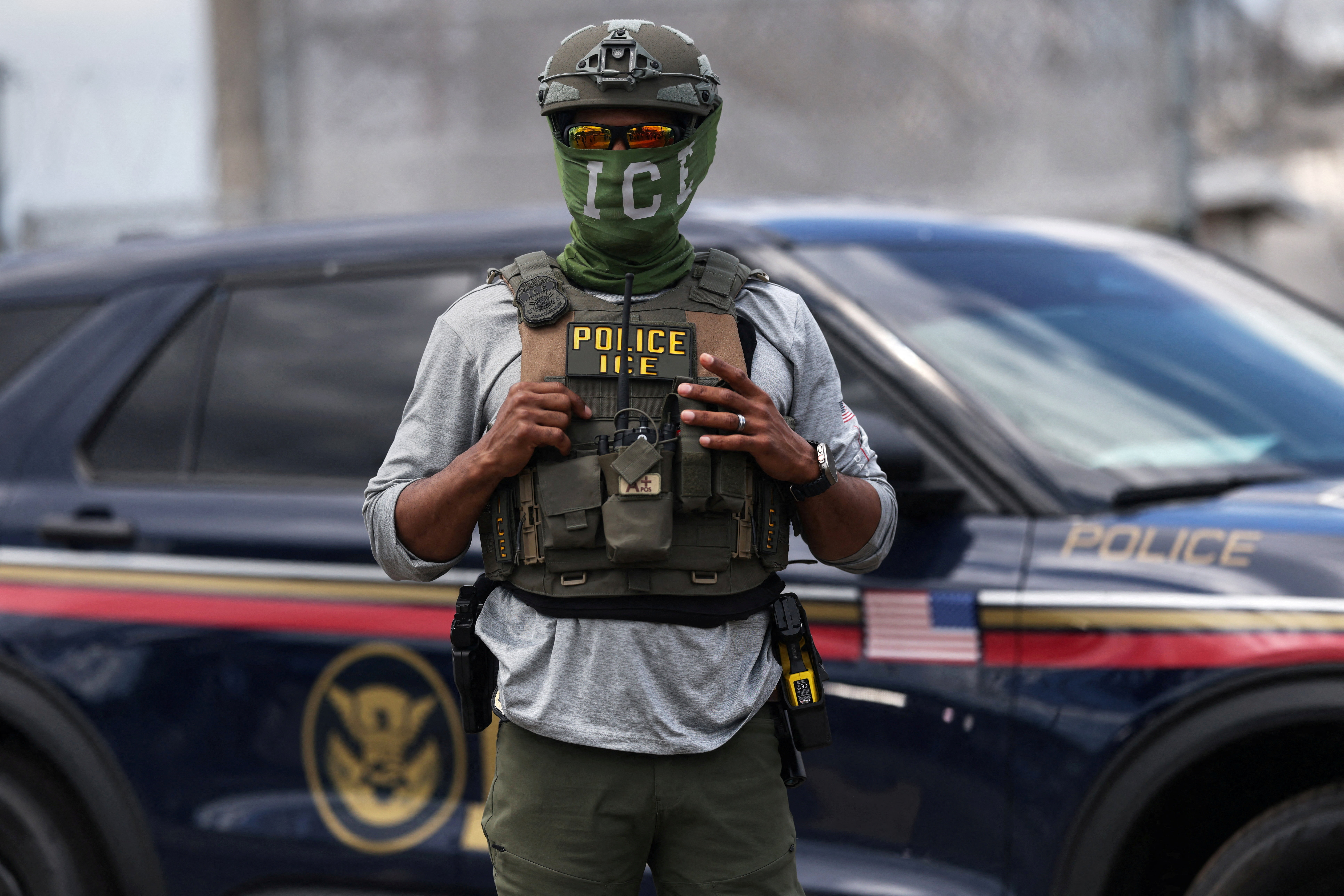 A U.S. Immigration and Customs Enforcement (ICE) agent stands guard outside Delaney Hall as demonstrators remain gathered in Newark, New Jersey, U.S., May 28, 2026. REUTERS/Shannon Stapleton
