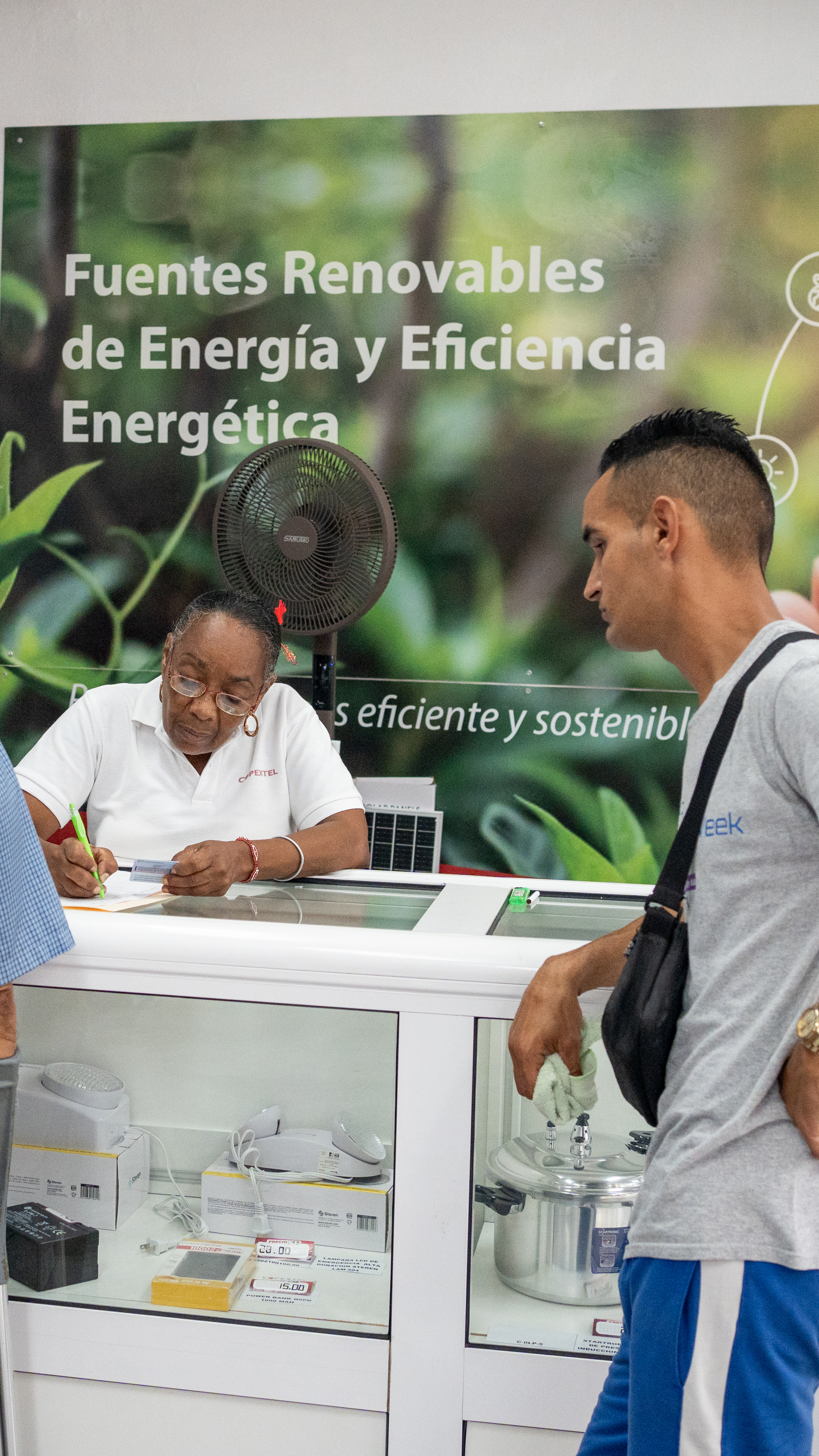 Customers inquire about solar energy systems at a Copextel store in Centro Habana as demand for photovoltaic equipment rises amid Cuba’s energy crisis. [Lucien Migne/Al Jazeera]