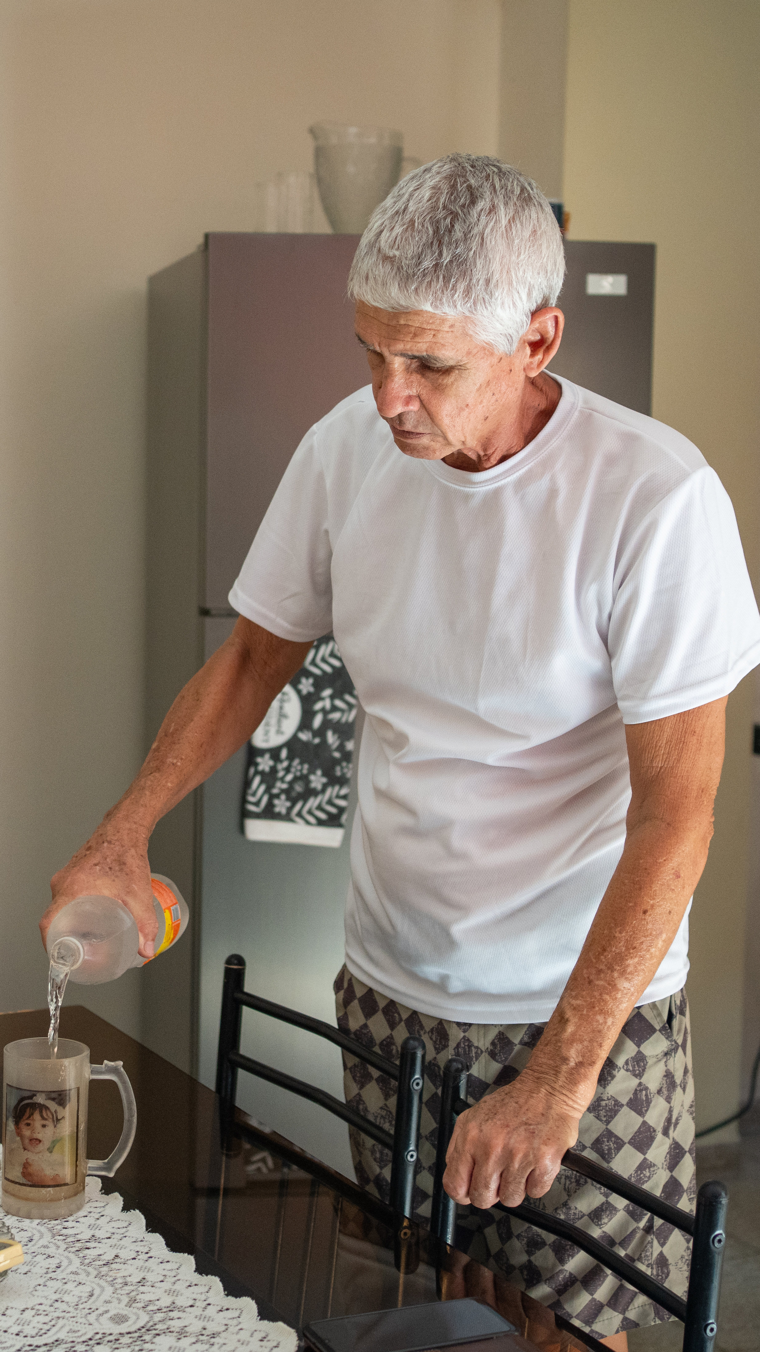Camilo Merejón at his home in Regla, Havana, where a prolonged blackout has left his neighborhood without electricity for 26 hours. [Lucien Migne/Al Jazeera]