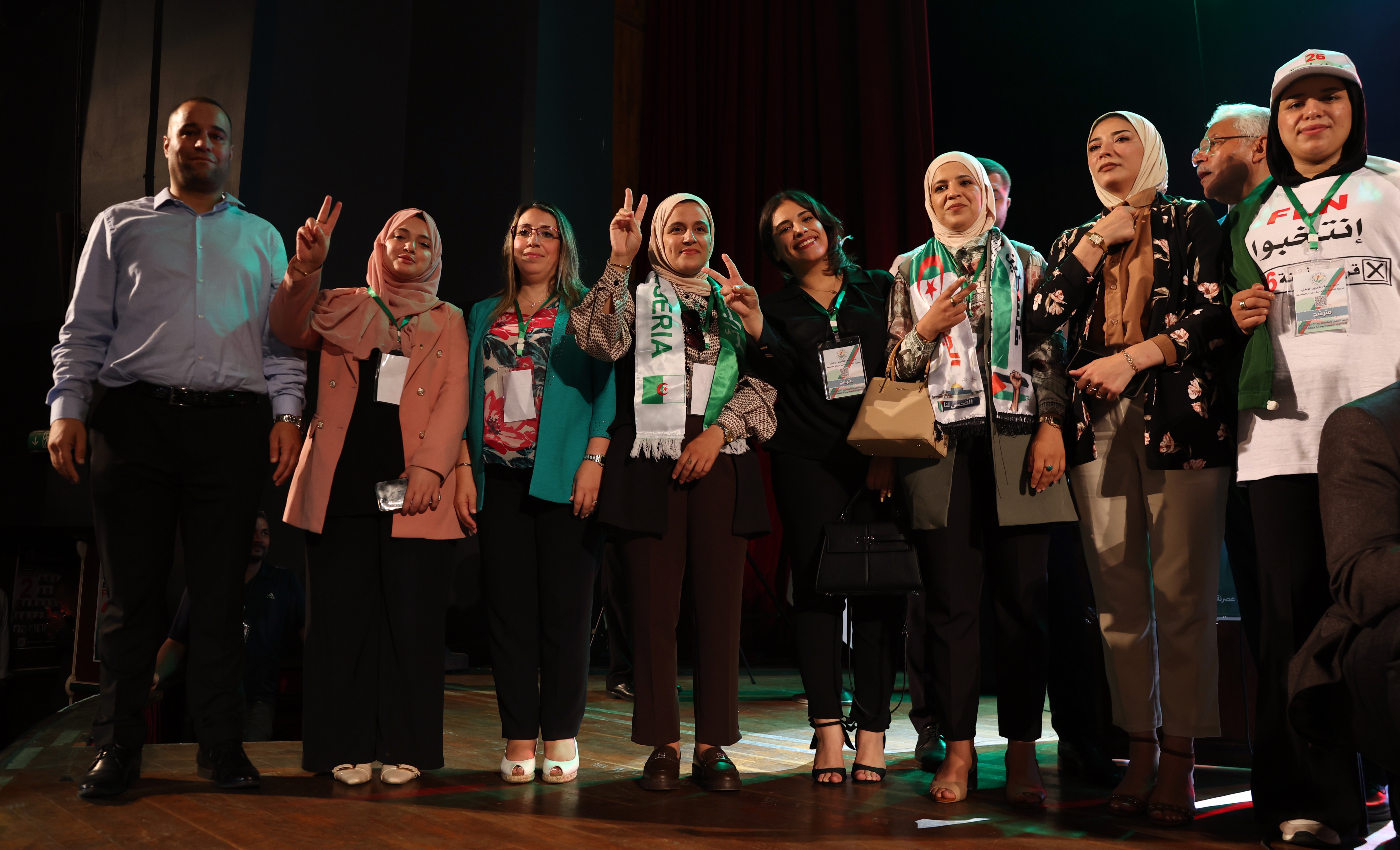 Candidates of the National Liberation Front (FLN) pose for a photograph during a legislative election campaign event in Algiers, before Algeria’s July 2 legislative elections