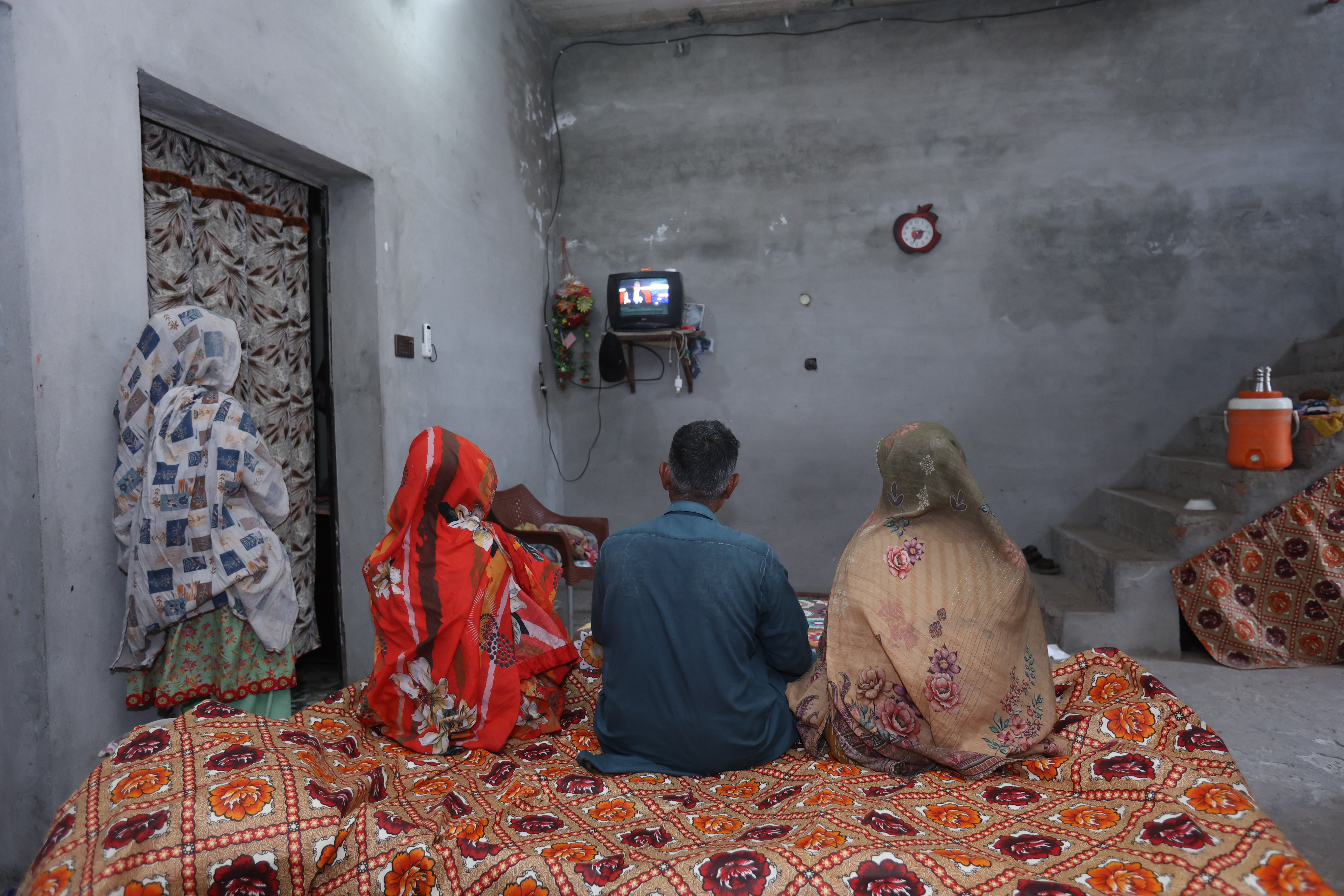 Abida Hussain (R) and her family unwind in the evenings, tuning into the latest Pakistani television serial