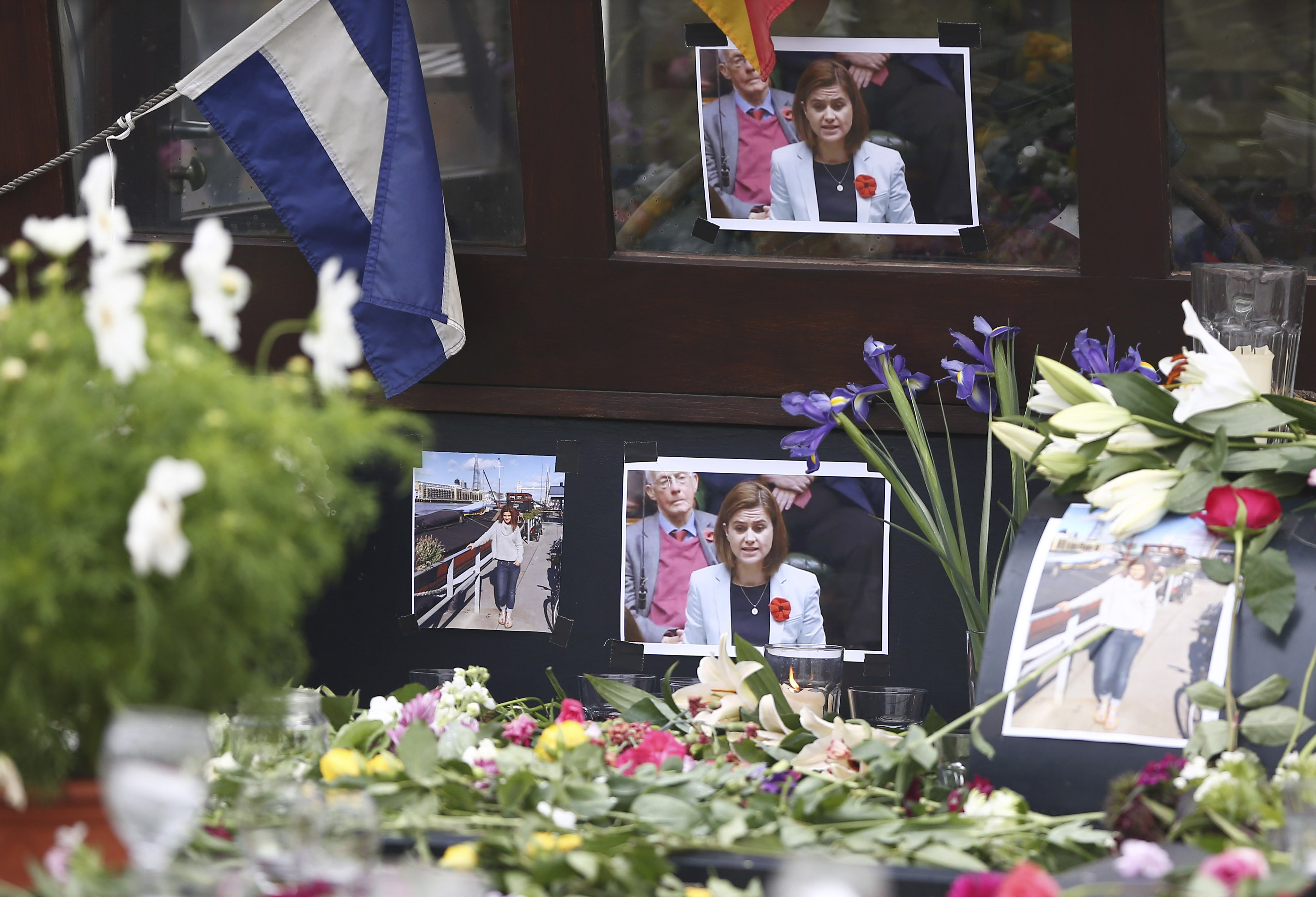 Tributes to Labour Party MP Jo Cox are placed on her houseboat in Wapping in London, Britain June 16, 2016. REUTERS/Neil Hall