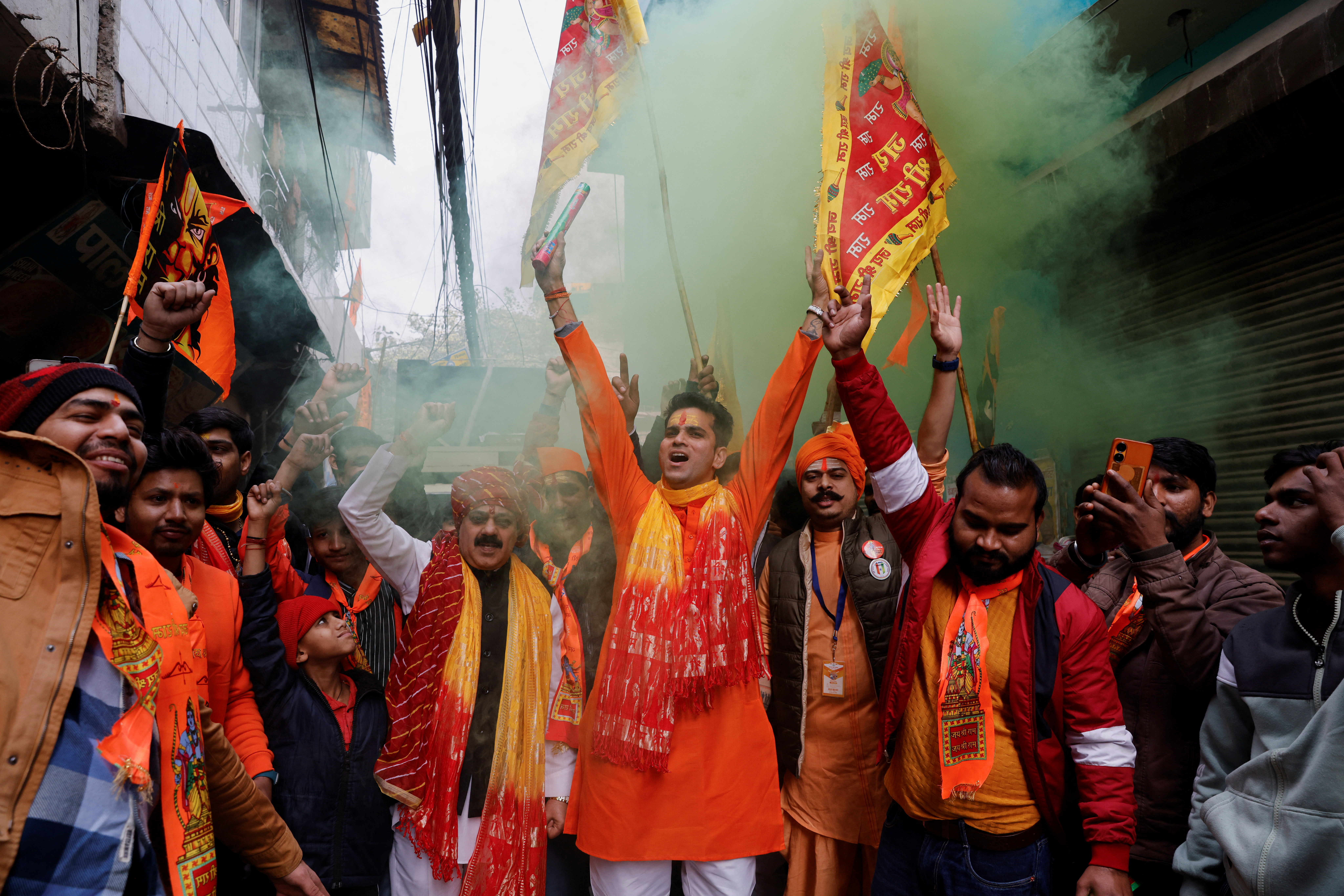 People celebrate the opening of the temple of the Hindu god Ram in the northern town of Ayodhya in a street in New Delhi, India, on January 22, 2024