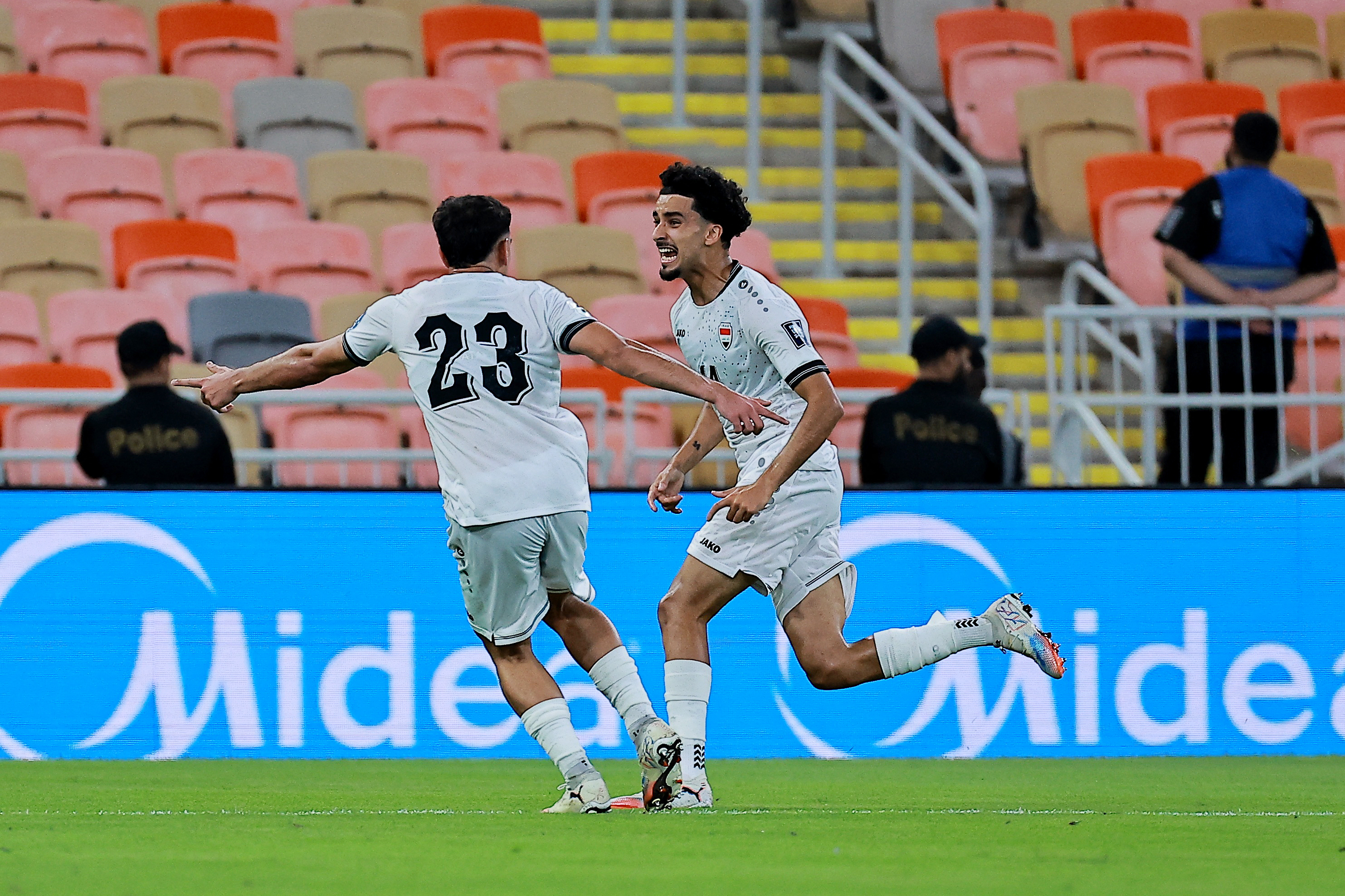Soccer Football - FIFA World Cup - AFC Qualifiers - Group B - Iraq v Indonesia - King Abdullah Sport City, Jeddah, Saudi Arabia - October 11, 2025 Iraq's Zidane Iqbal celebrates scoring their first goal with Merchas Doski REUTERS/Stringer