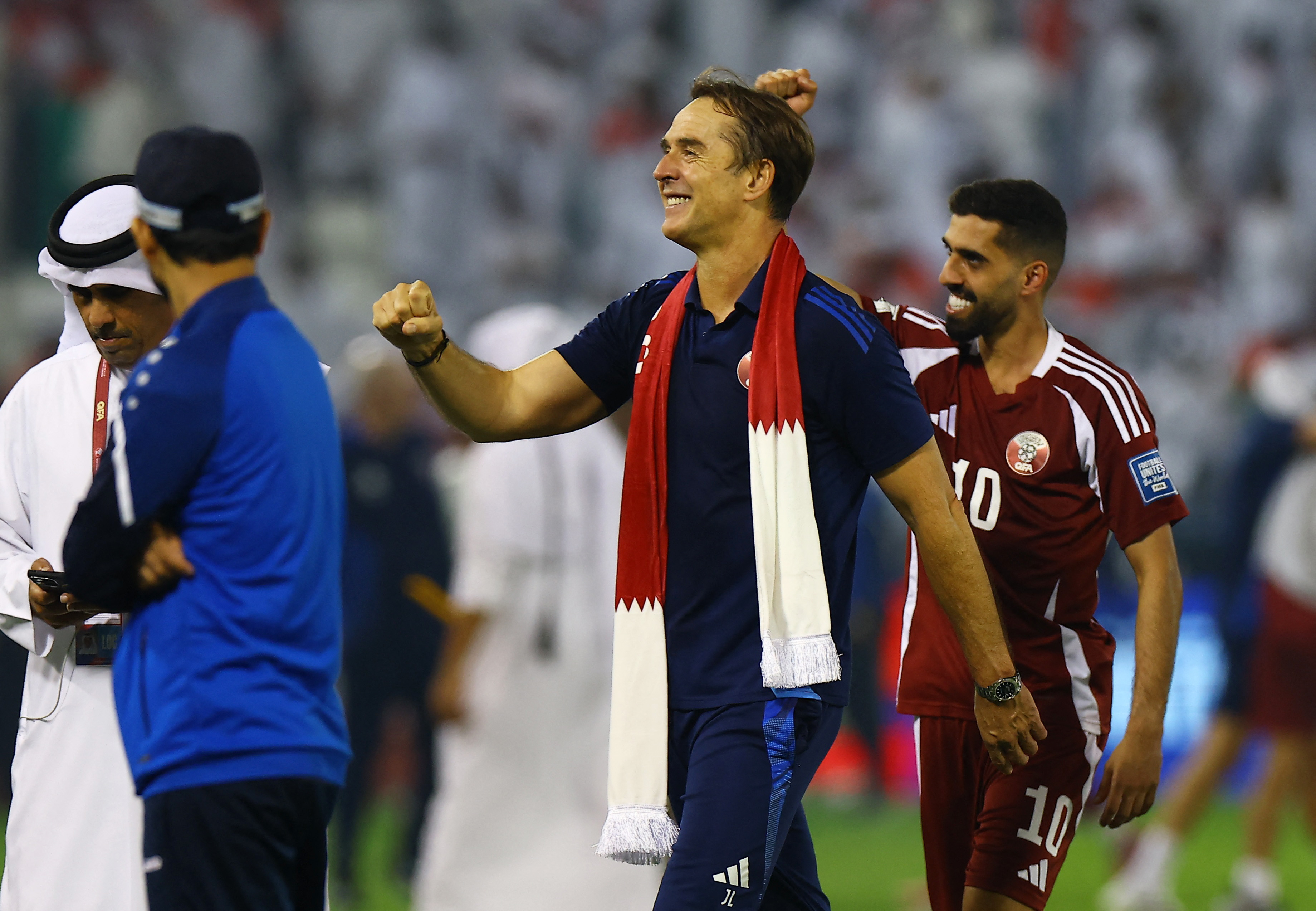 Soccer Football - FIFA World Cup - AFC Qualifiers - Group A - Qatar v United Arab Emirates - Jassim Bin Hamad Stadium, Doha, Qatar - October 14, 2025 Qatar coach Julen Lopetegui celebrates with Hassan Al Haydos after qualifying for the FIFA World Cup REUTERS/Ibraheem Al Omari