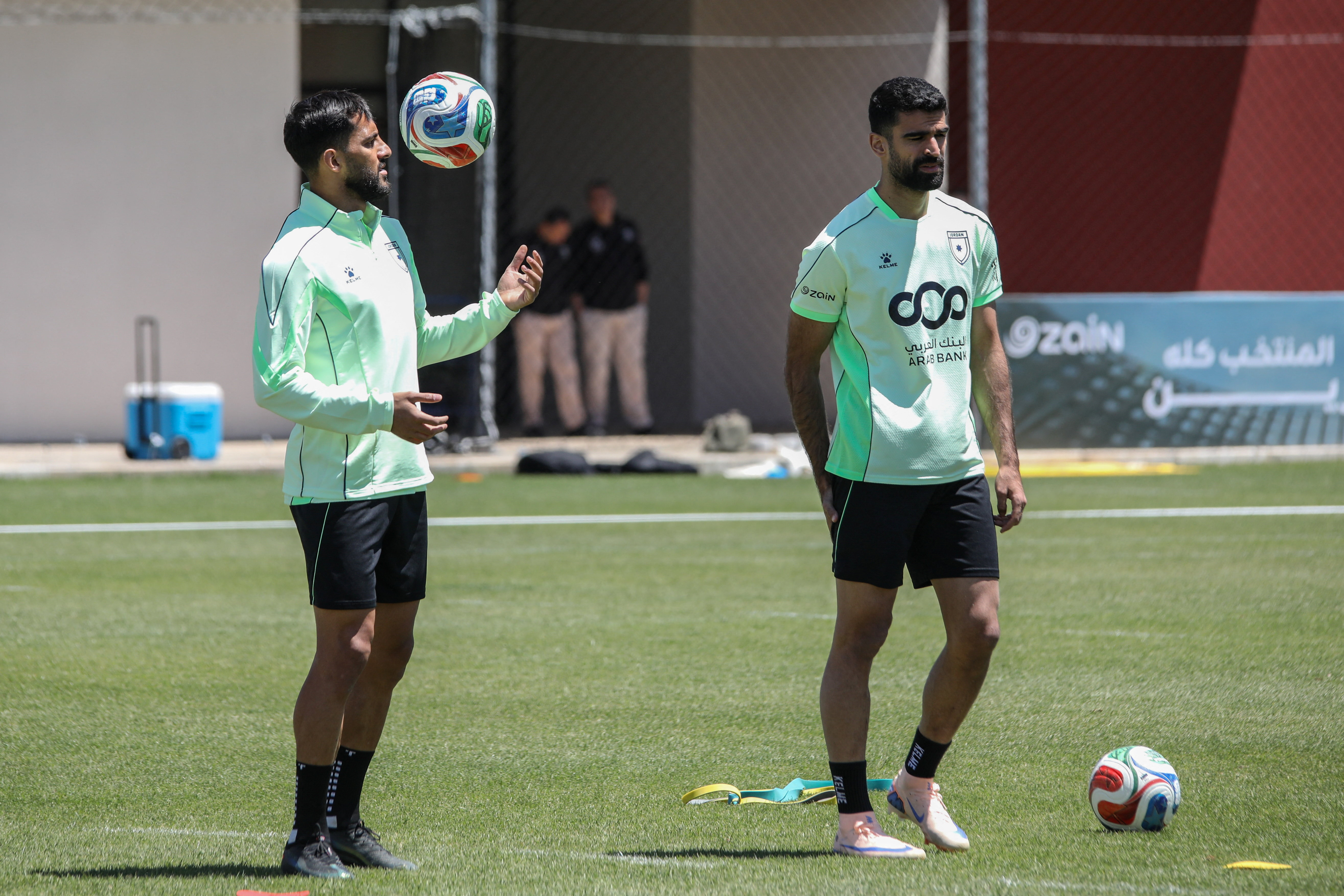 Jordan national soccer team players Mousa Al-Tamari and Nizar Al-Rashdan take part in a training session