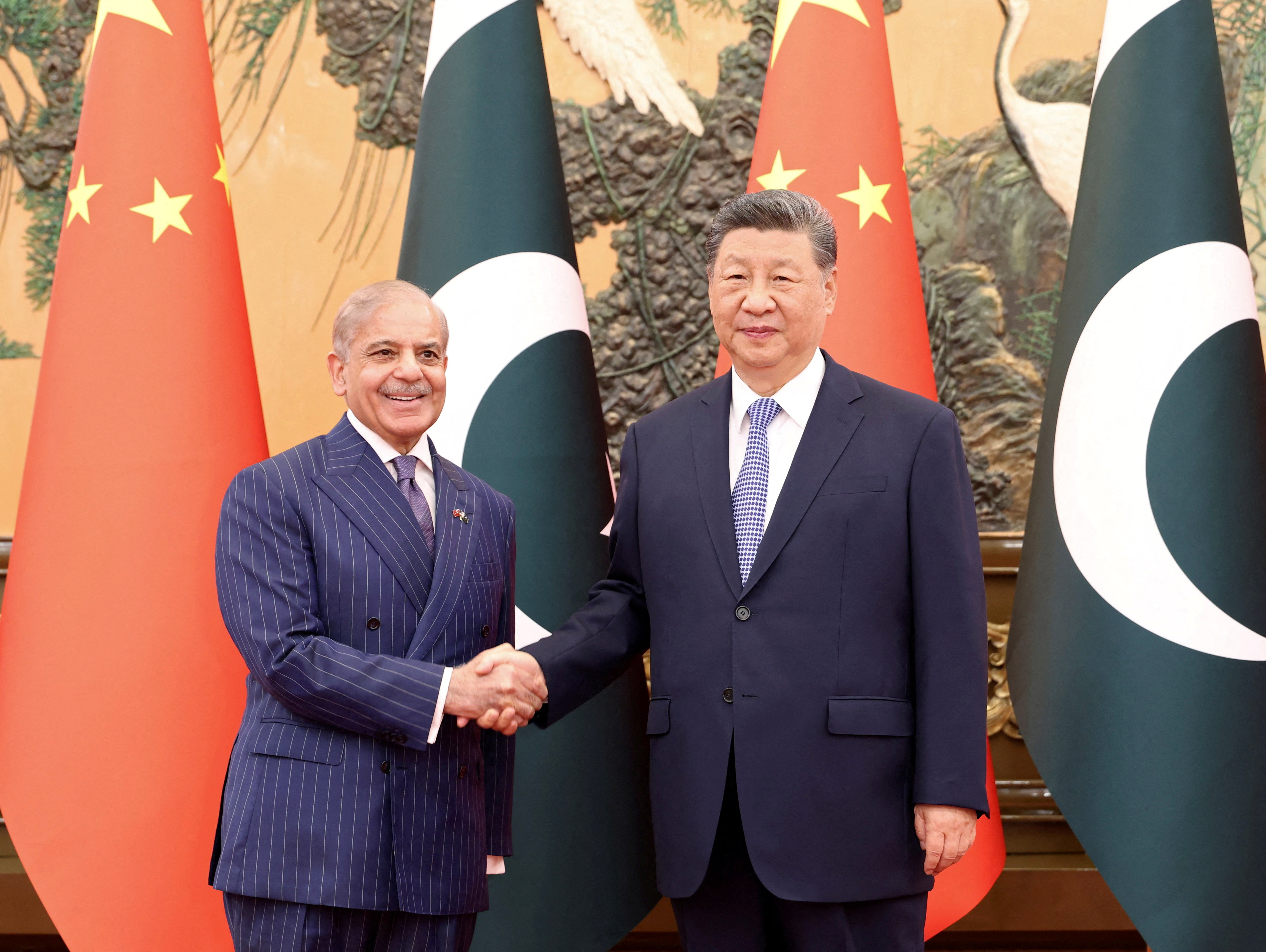 Chinese President Xi Jinping and Pakistani Prime Minister Shehbaz Sharif shake hands at the Great Hall of the People in Beijing, China May 25, 2026. China Daily via REUTERS ATTENTION EDITORS - THIS PICTURE WAS PROVIDED BY A THIRD PARTY. CHINA OUT. NO COMMERCIAL OR EDITORIAL SALES IN CHINA. TPX IMAGES OF THE DAY