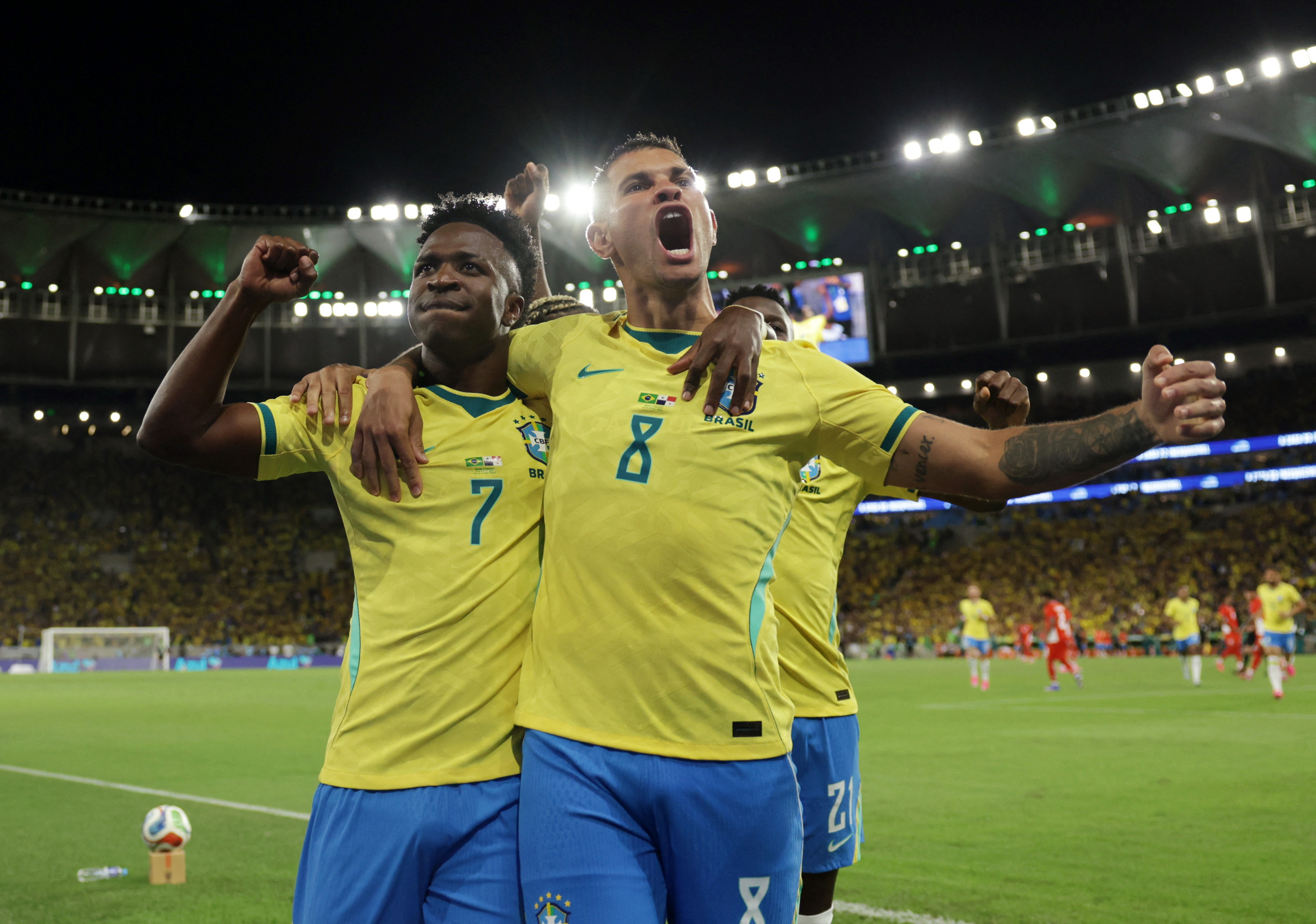 Brazil's Vinicius Junior celebrates scoring their first goal with Bruno Guimaraes 