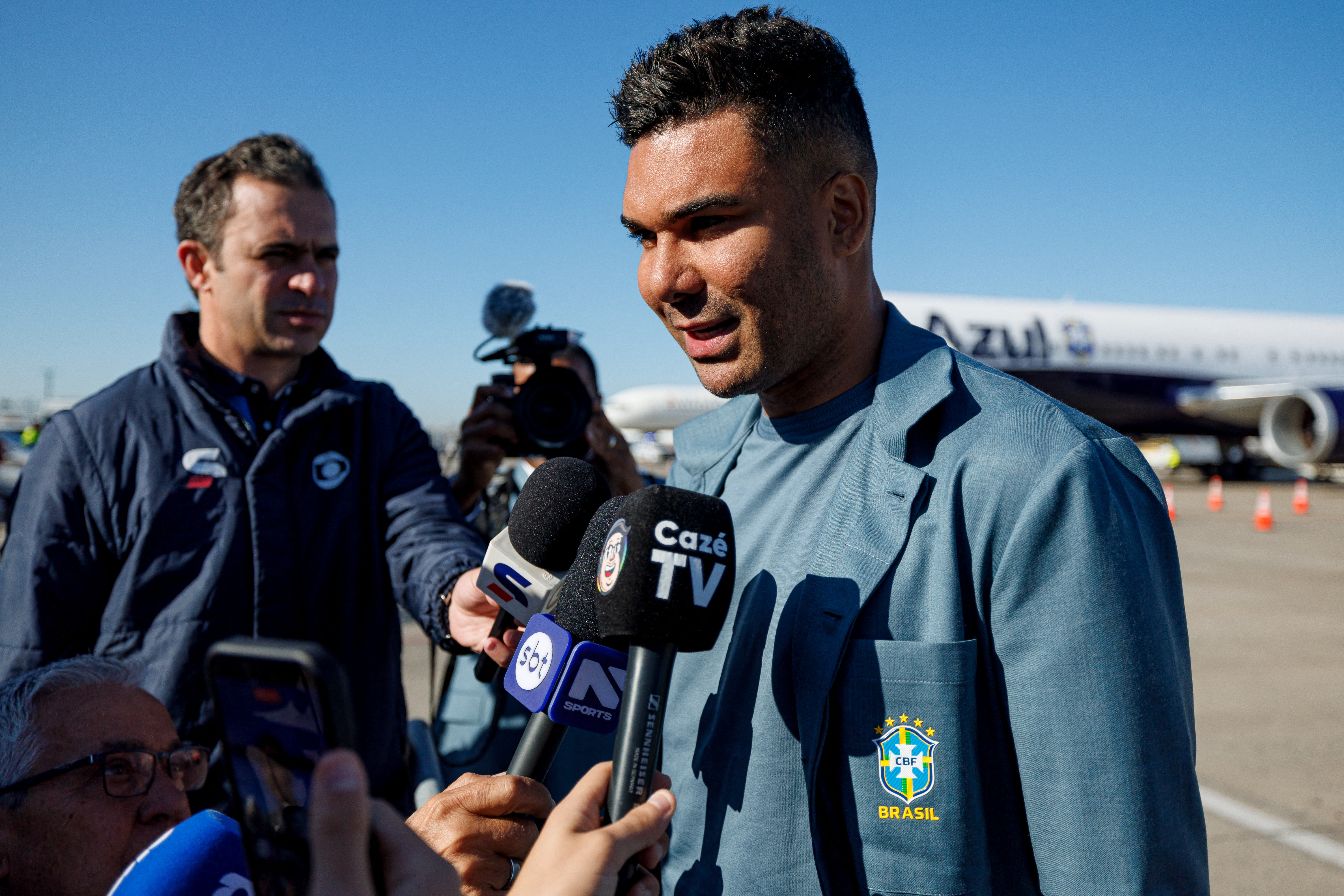 Jun 2, 2026; Newark, New Jersey, USA; Brazil midfielder Casemiro speaks to media after arriving for the 2026 FIFA World Cup at Newark Liberty International Airport. Mandatory Credit: Caean Couto-Imagn Images
