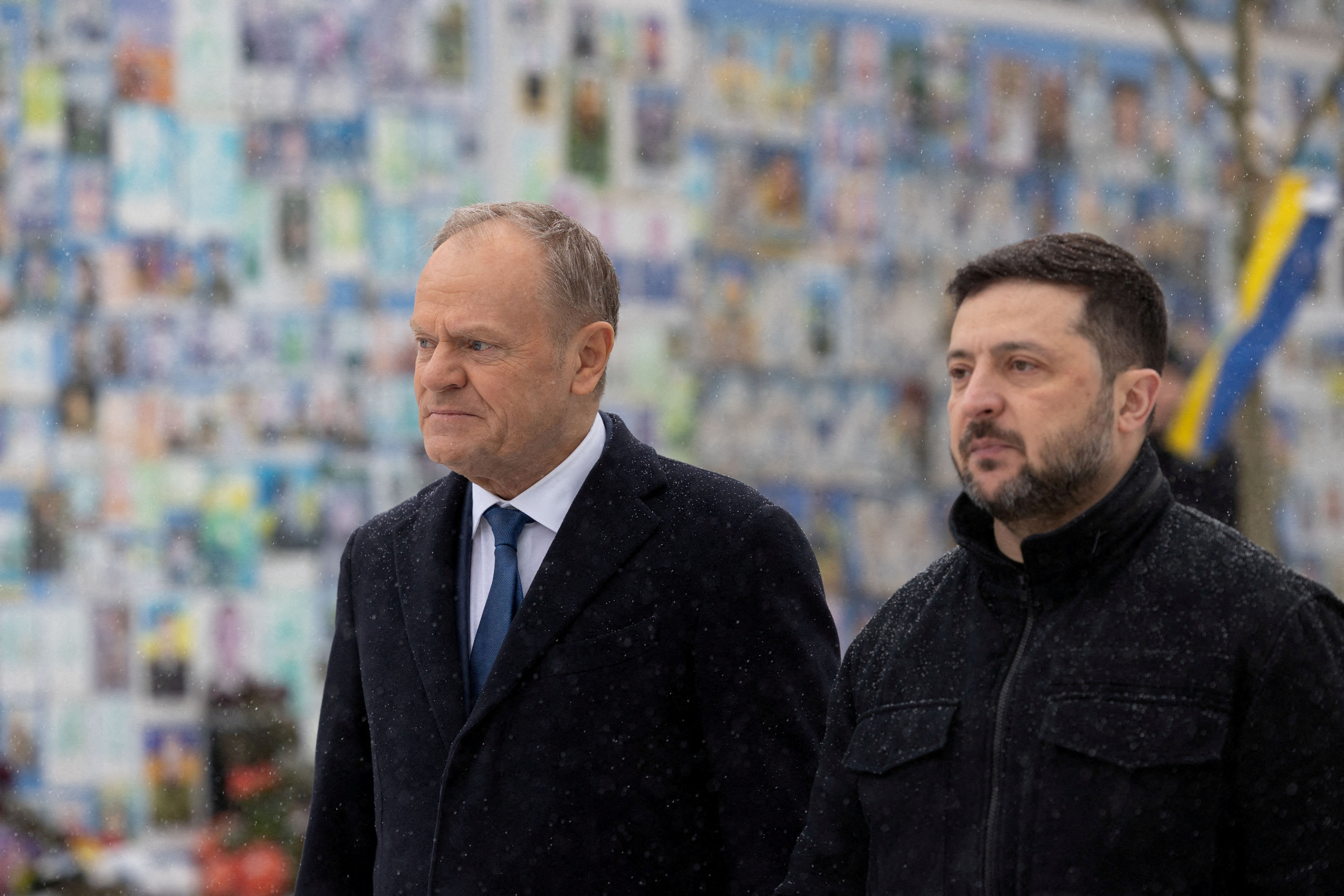 FILE PHOTO: Ukraine's President Volodymyr Zelenskiy and Polish Prime Minister Donald Tusk visit the Wall of Remembrance of the Fallen for Ukraine outside the Saint Michael's Cathedral, amid Russia's attack on Ukraine, in Kyiv, Ukraine February 5, 2026. Ukrainian Presidential Press Service/Handout via REUTERS ATTENTION EDITORS - THIS IMAGE HAS BEEN SUPPLIED BY A THIRD PARTY./File Photo