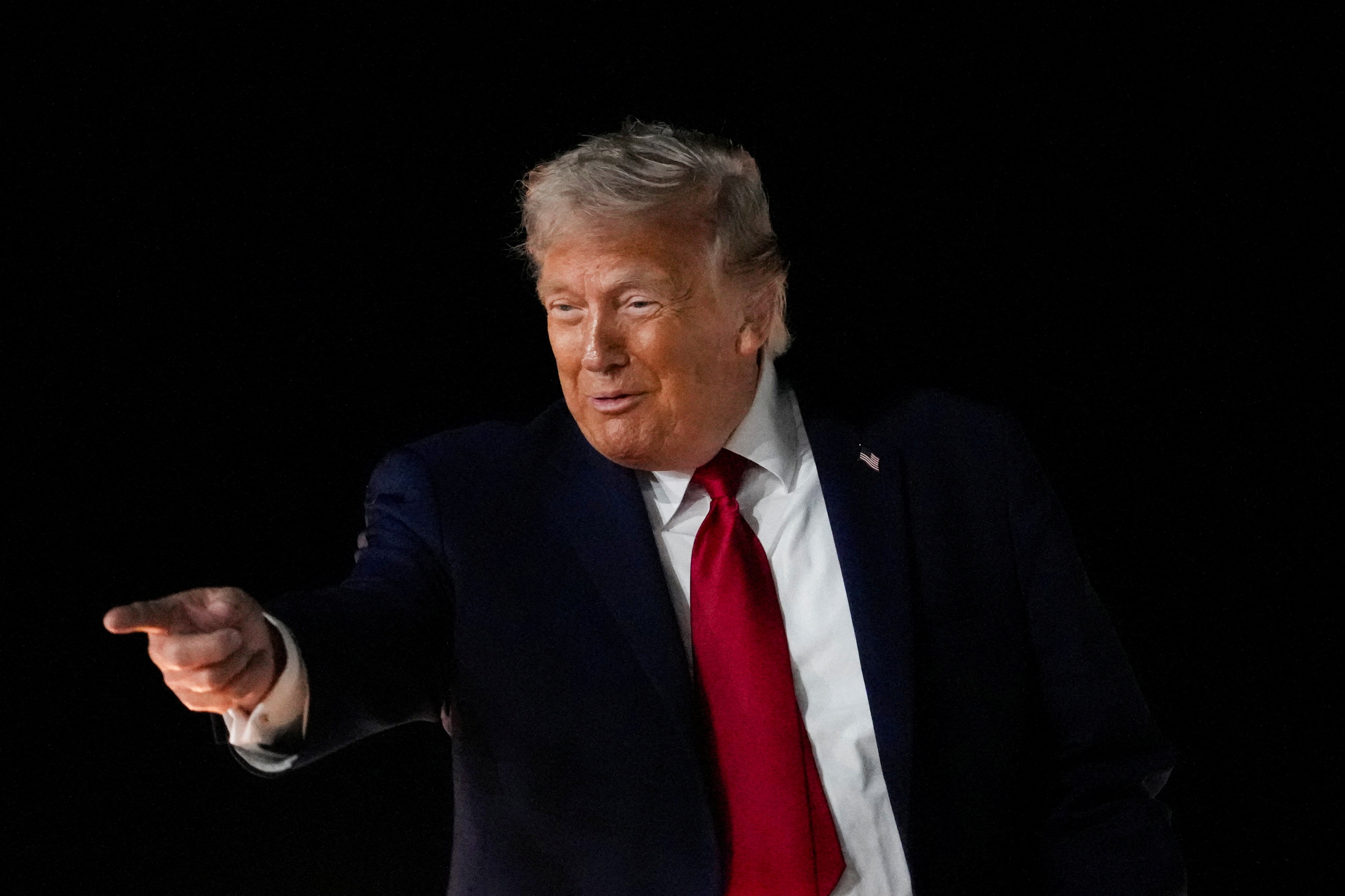 US President Donald Trump reacts.