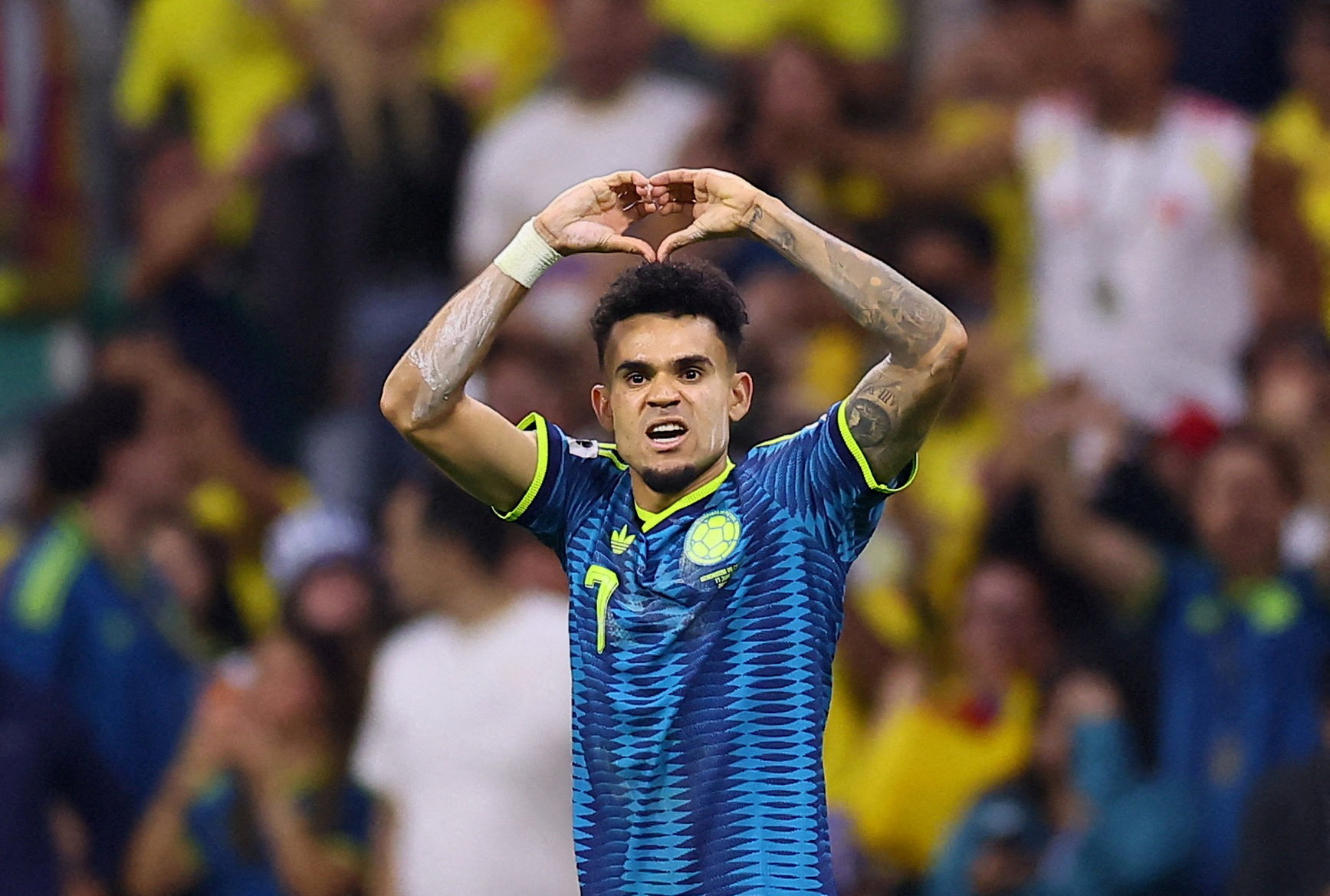 The Colombian winger celebrates on the pitch after scoring their second goal